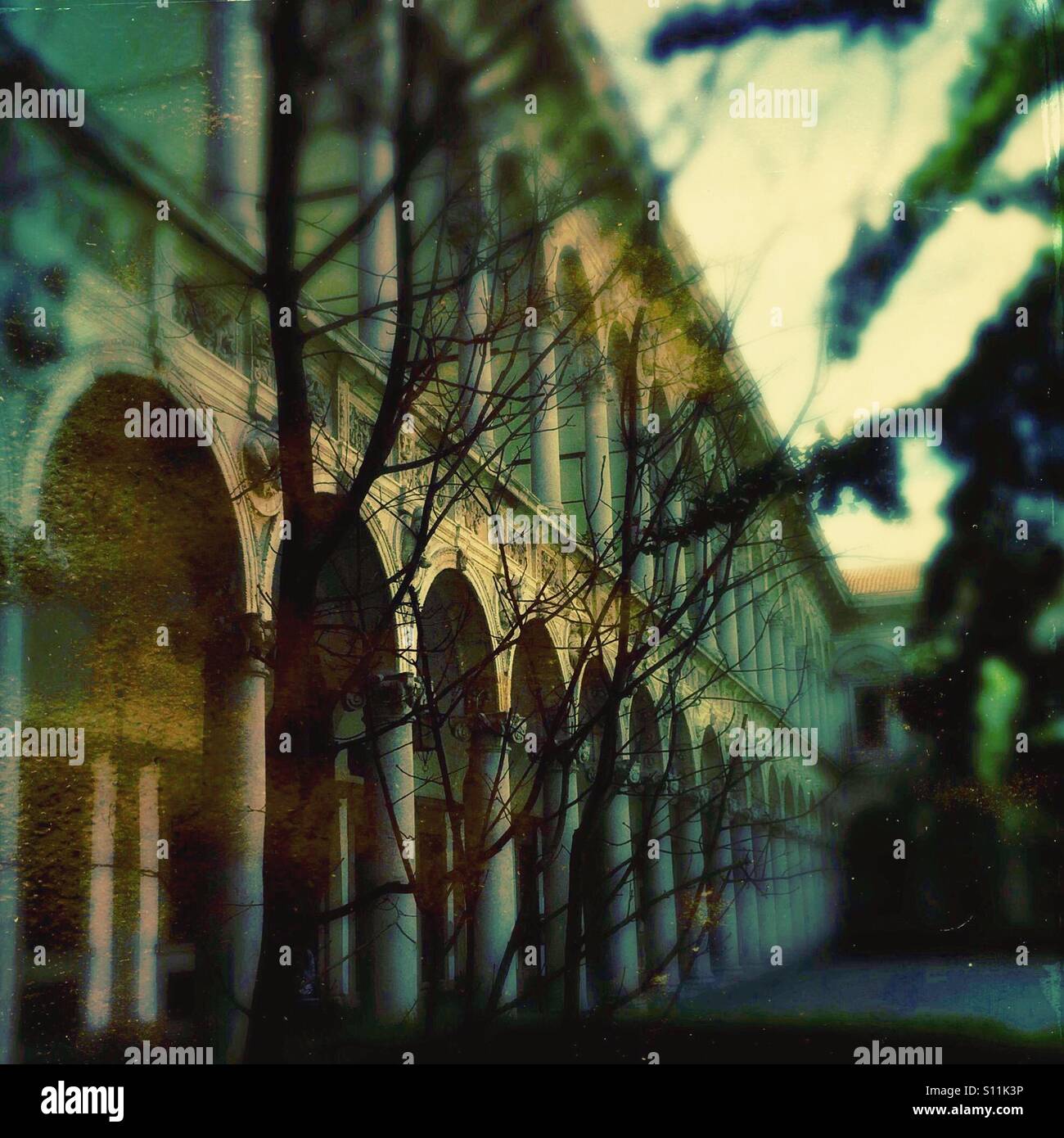 Arched  arcade in a cloister of a medieval hospital - Smartphone Captured Stock Image