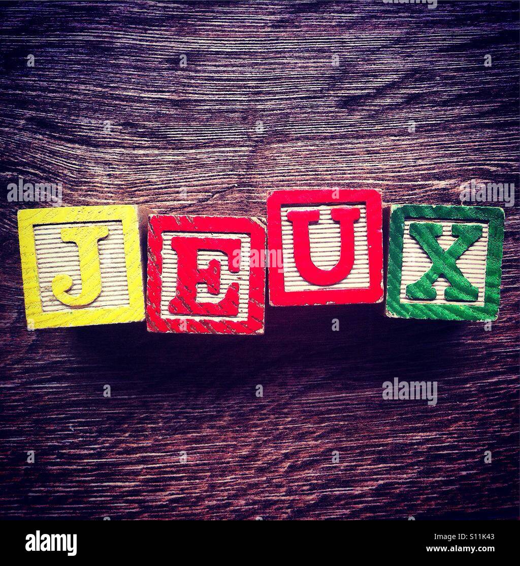 French word JEUX meaning GAMES done with alphabet wood blocks letters Stock Photo