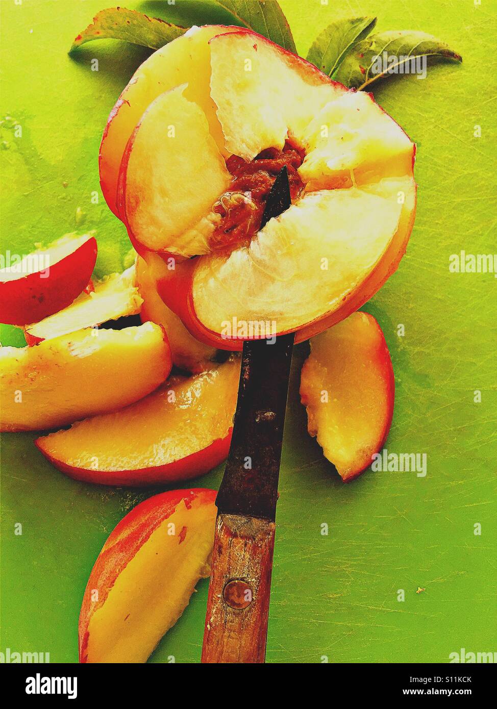 Fresh peach with slices and knife - Smartphone Captured Stock Image