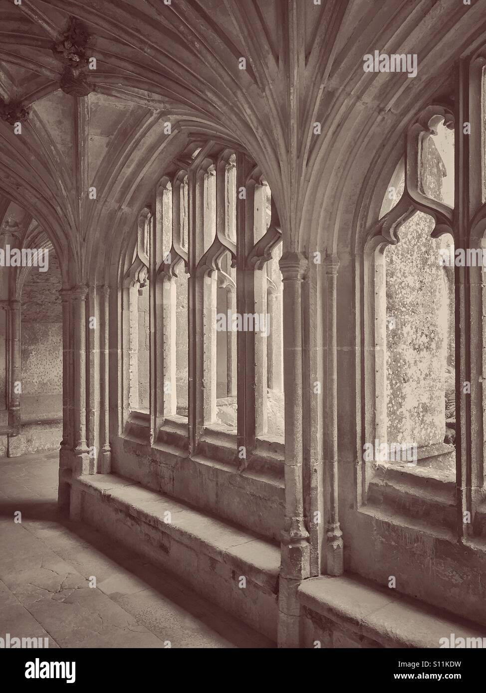 The Cloisters Area of Lacock Abbey, Wiltshire, England. This area was used as Prof. Lockhart's Room (Hogwart's School) in the Harry Potter film 'The Chamber of Secrets.' Photo © COLIN HOSKINS. - Smartphone Captured Stock Image