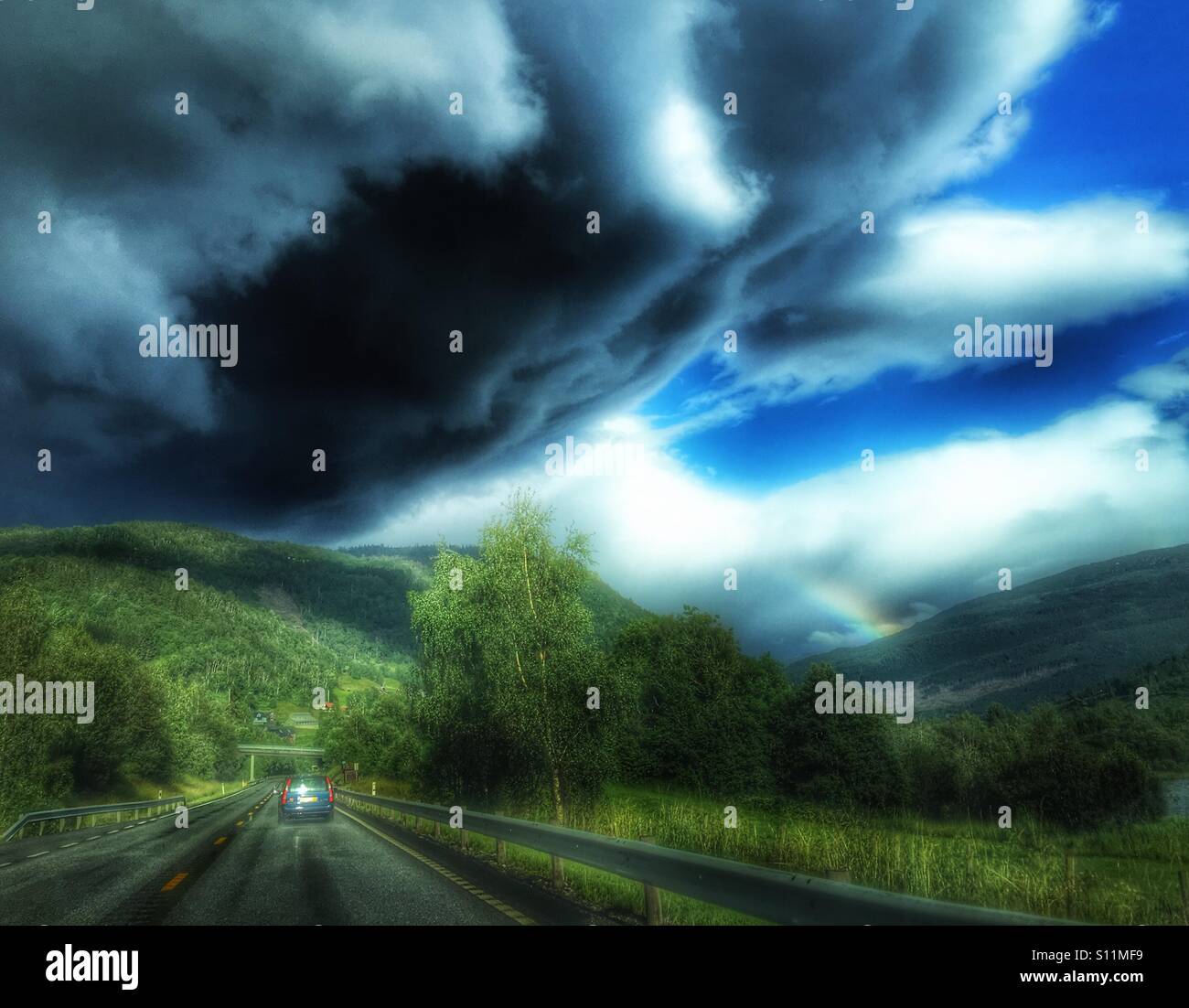 Dark clouds and rainbow hi-res stock photography and images - Alamy