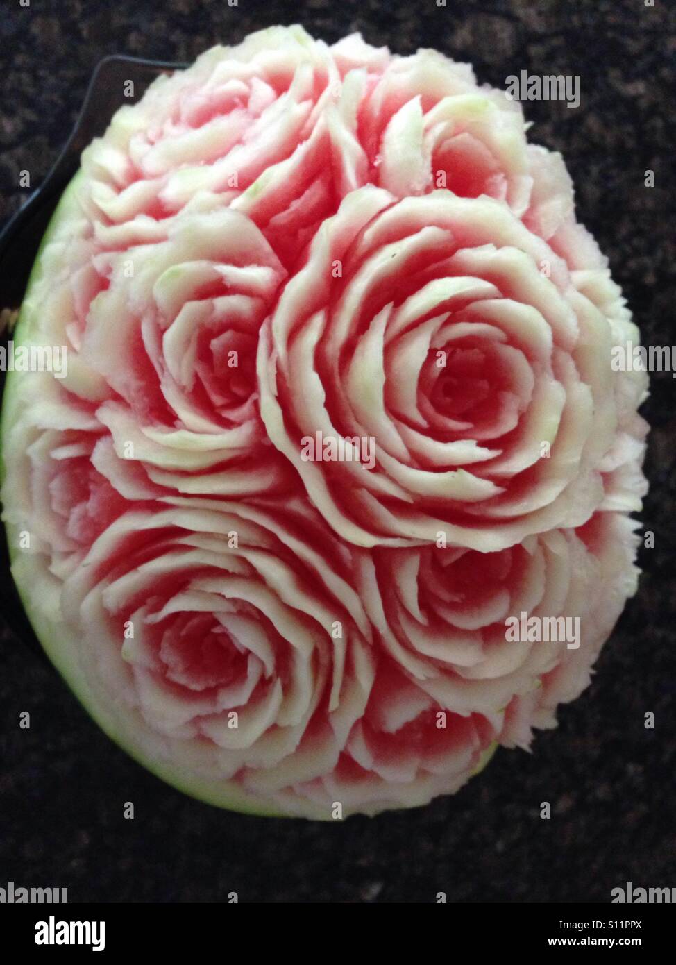 Fruit carving of roses using watermelon Stock Photo