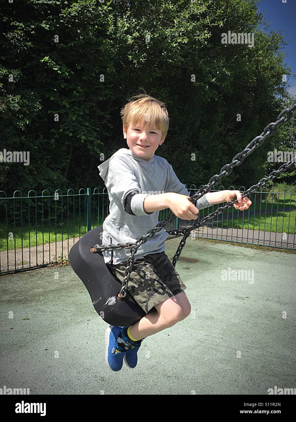Boy on a swing Stock Photo
