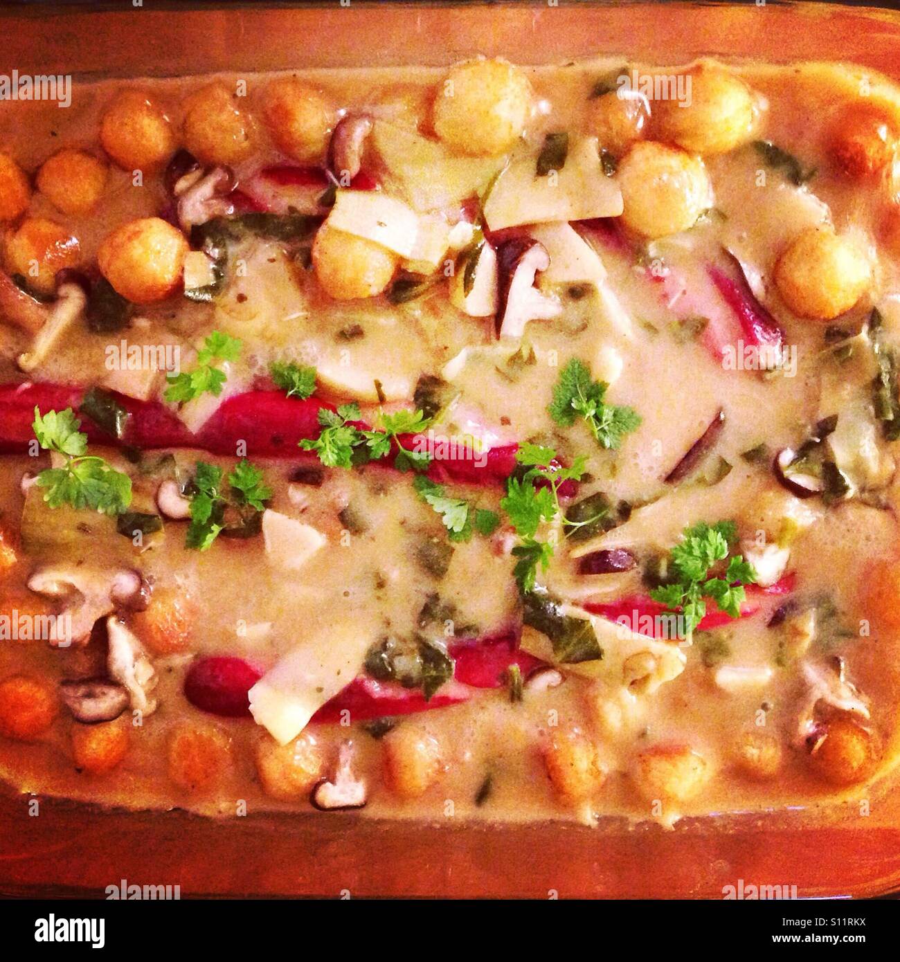 Baked sausage, mushrooms & potatoes with sauce Stock Photo Alamy