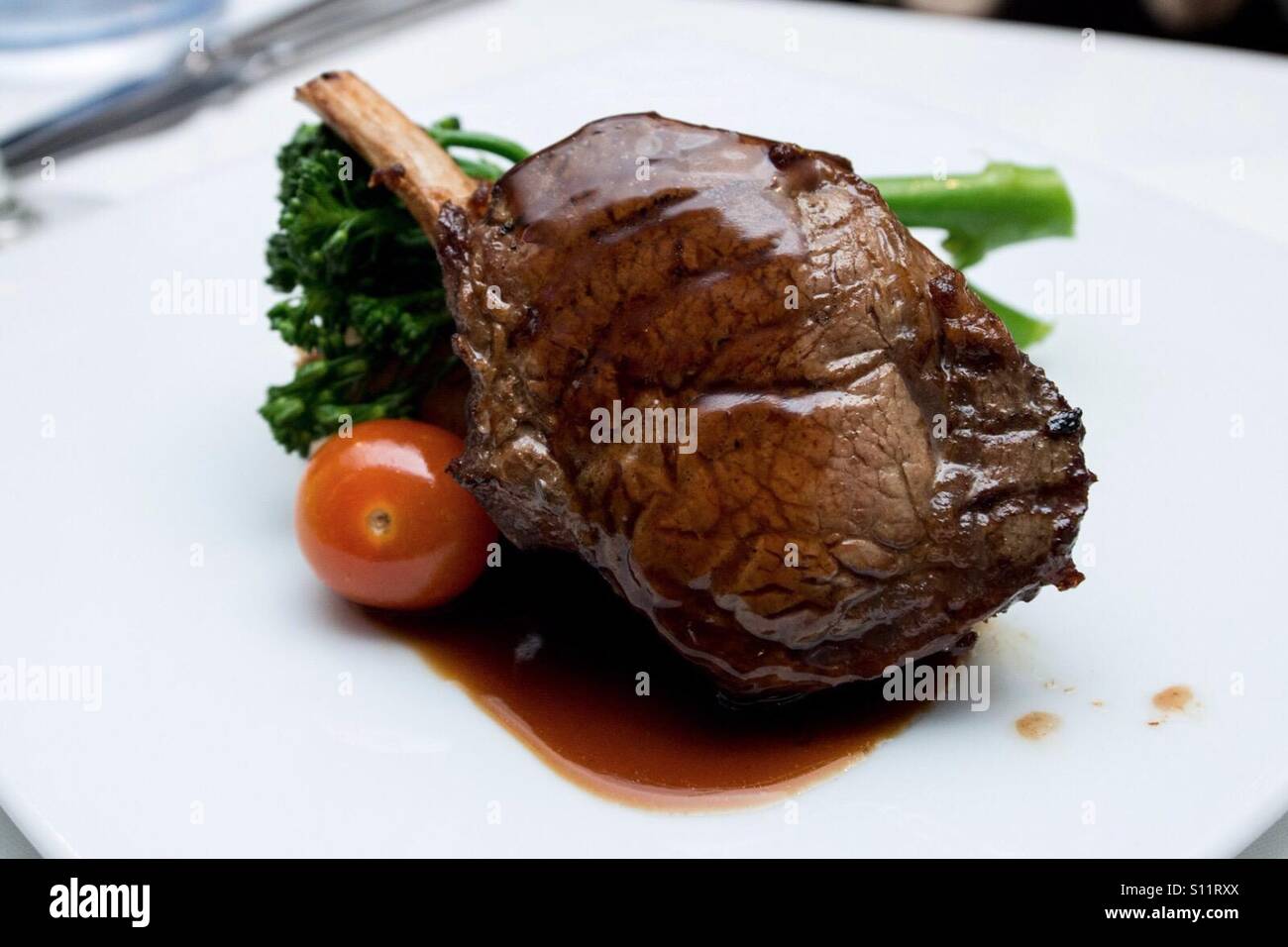 Rib eye steak with gravy and vegetables Stock Photo Alamy