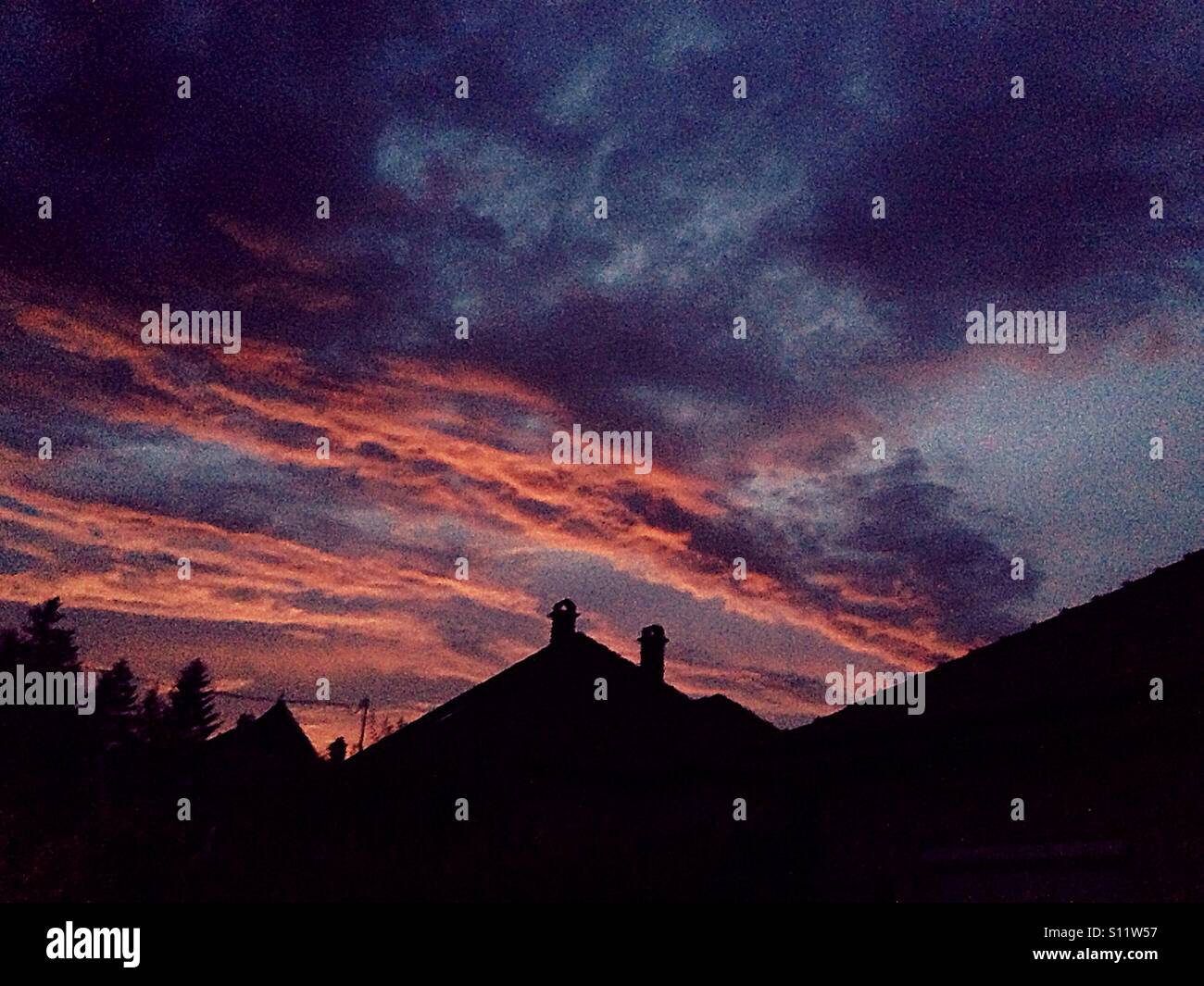 Colorful clouds over the roofs - Smartphone Captured Stock Image