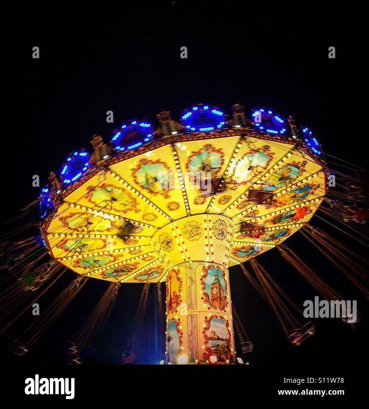 Carousel swings at the fun fair Stock Photo Alamy