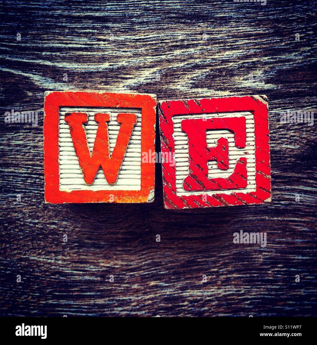 WE word done with wood blocks letters - Smartphone Captured Stock Image
