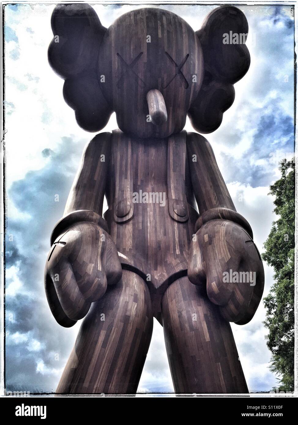 KAWS wooden sculpture Stock Photo Alamy