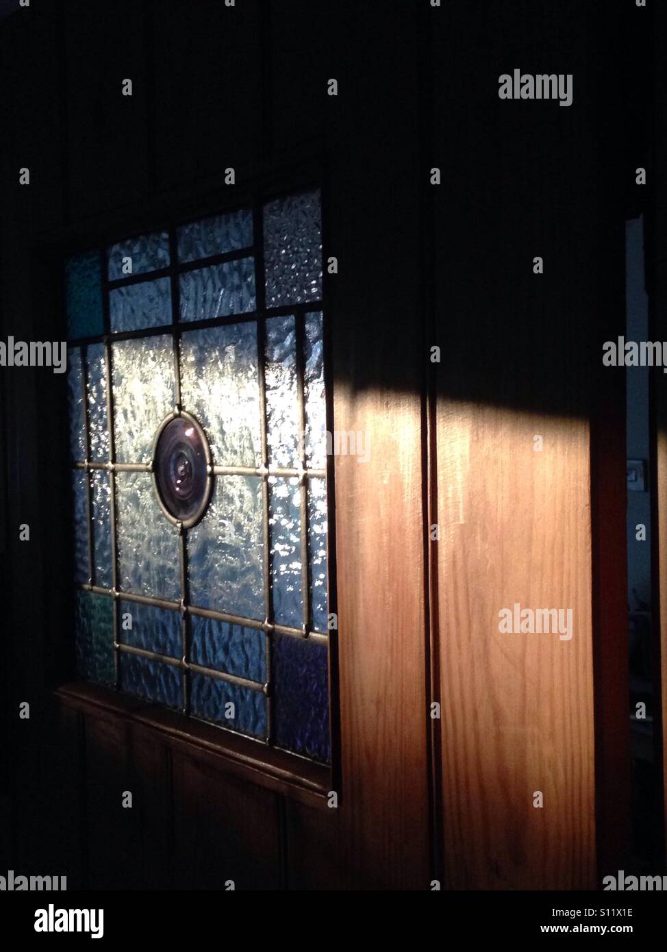 Shaft of evening sunlight on a door - Smartphone Captured Stock Image