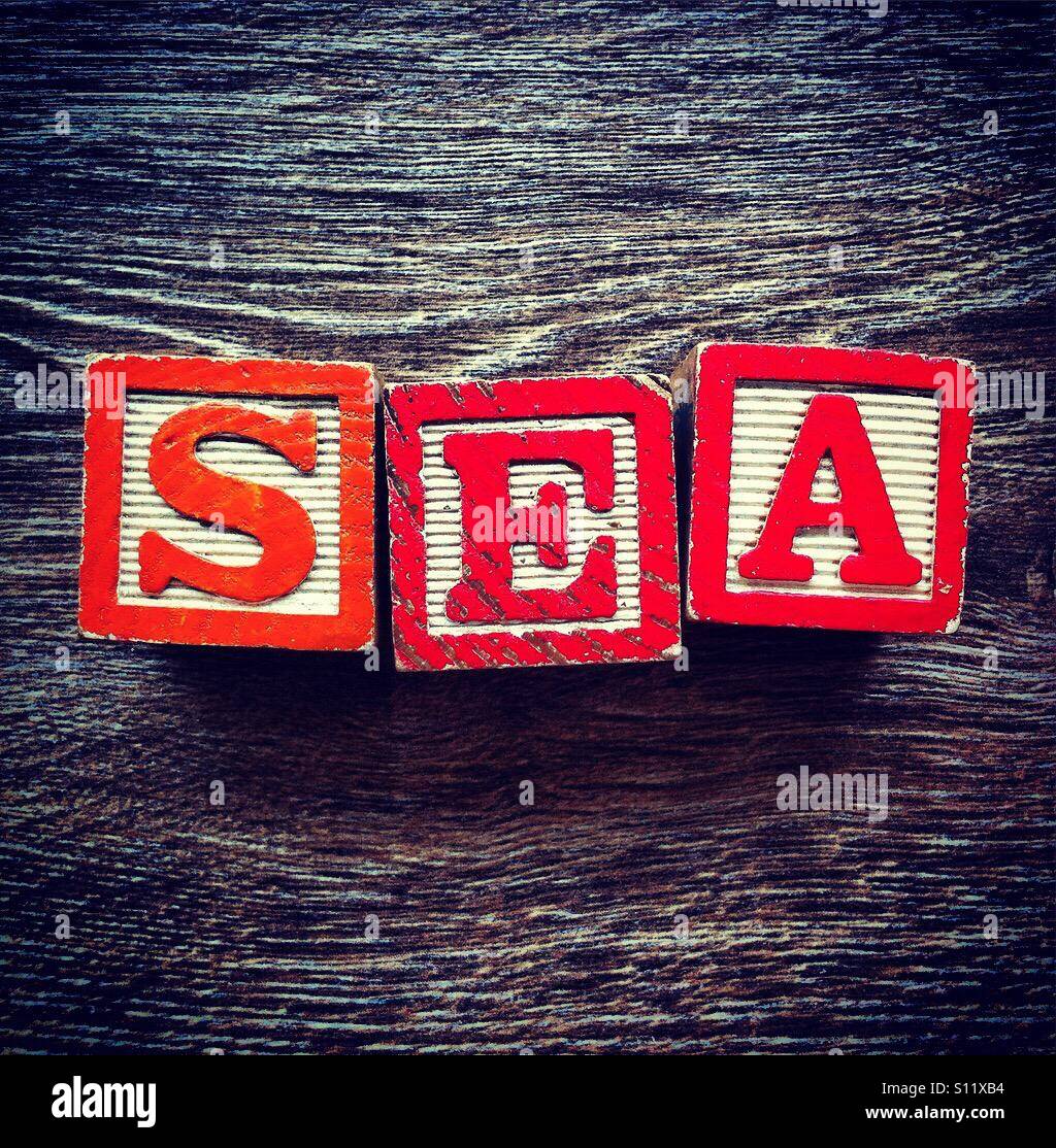 SEA word done with wood blocks letters - Smartphone Captured Stock Image