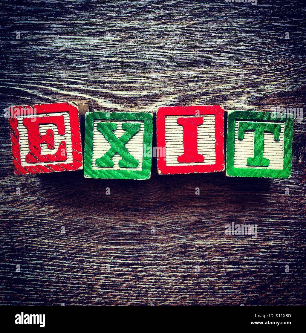 EXIT word done with wood blocks letters - Smartphone Captured Stock Image