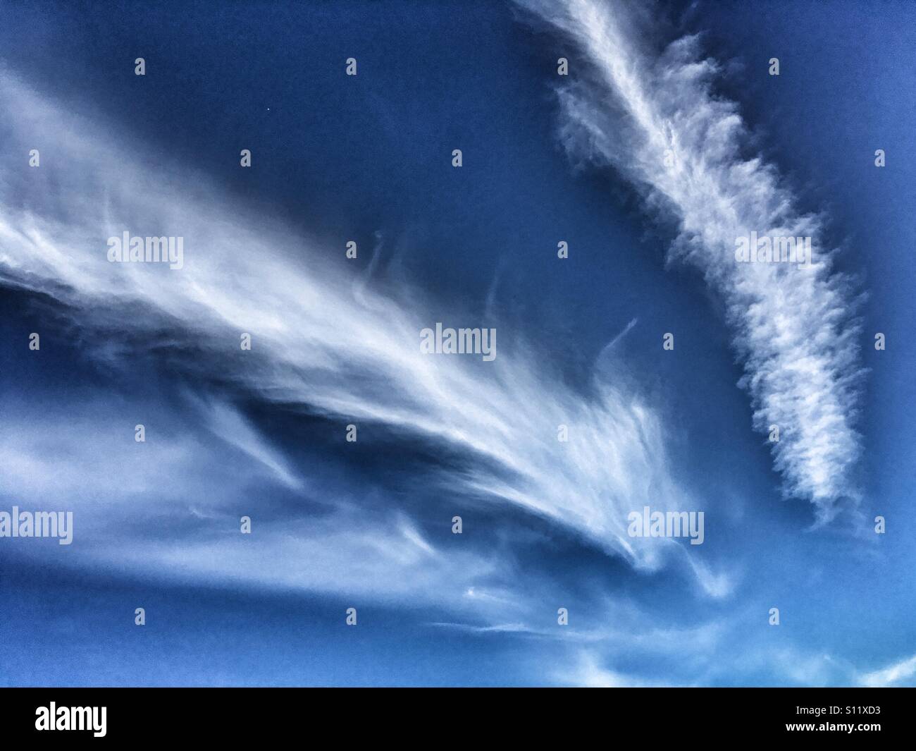 Feather like clouds in a blue sky - Smartphone Captured Stock Image