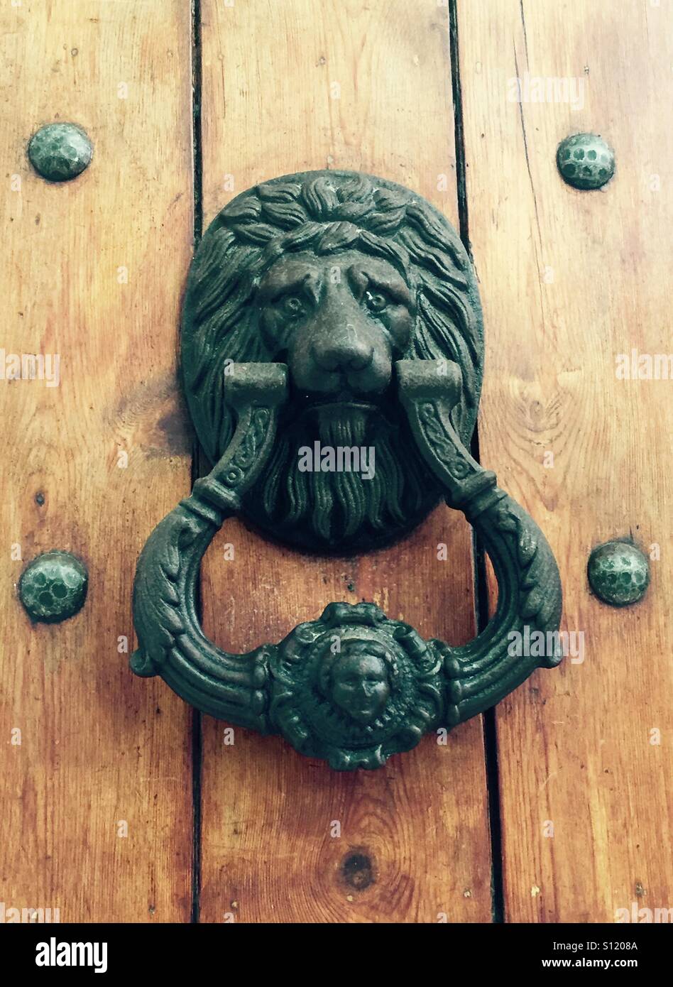 Lion brass door knocker Marbella Spain - Smartphone Captured Stock Image