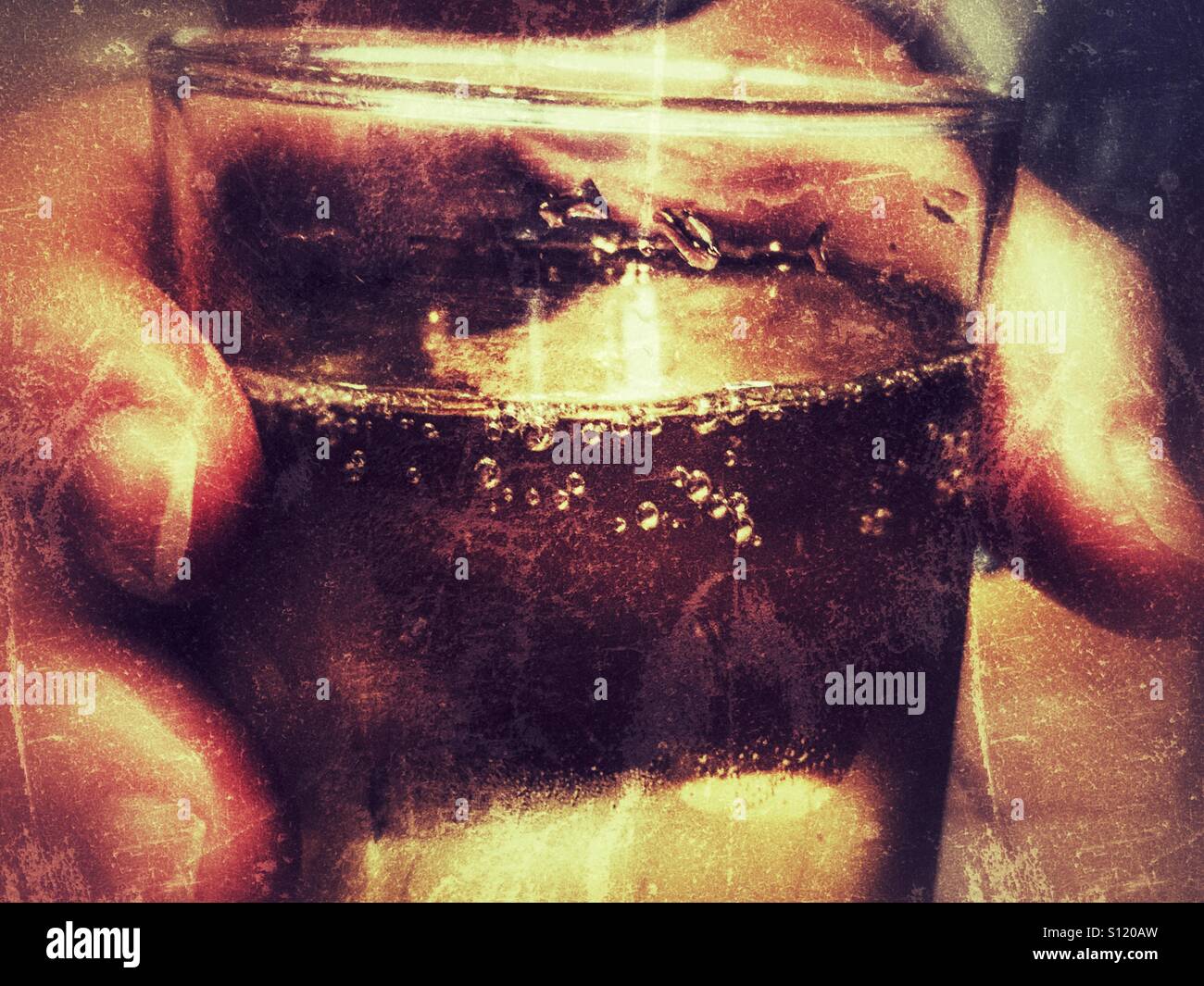 Hand holding a glass of cava. - Smartphone Captured Stock Image