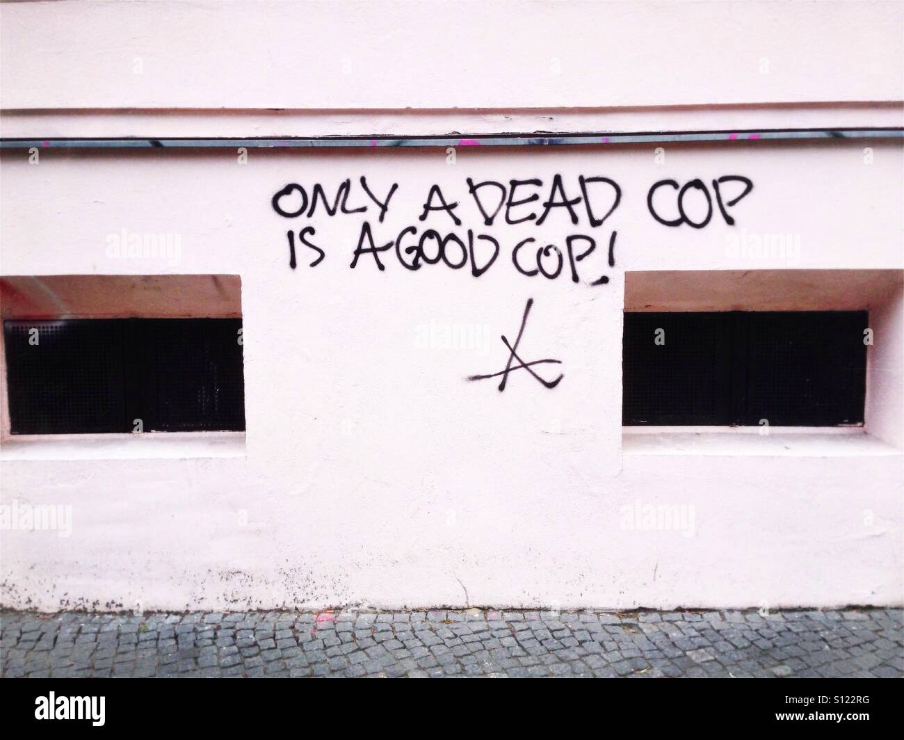 Only a dead cop is a good cop: graffiti on a wall in the Berlin district Kreuzberg, Germany - Smartphone Captured Stock Image
