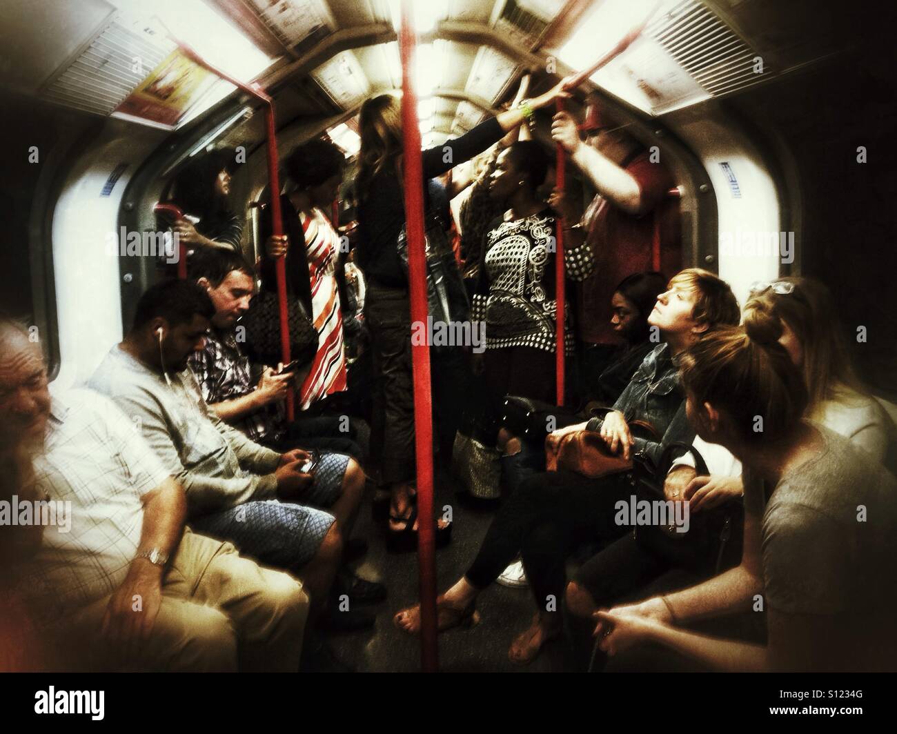 Passengers onboard a London Underground train. - Smartphone Captured Stock Image