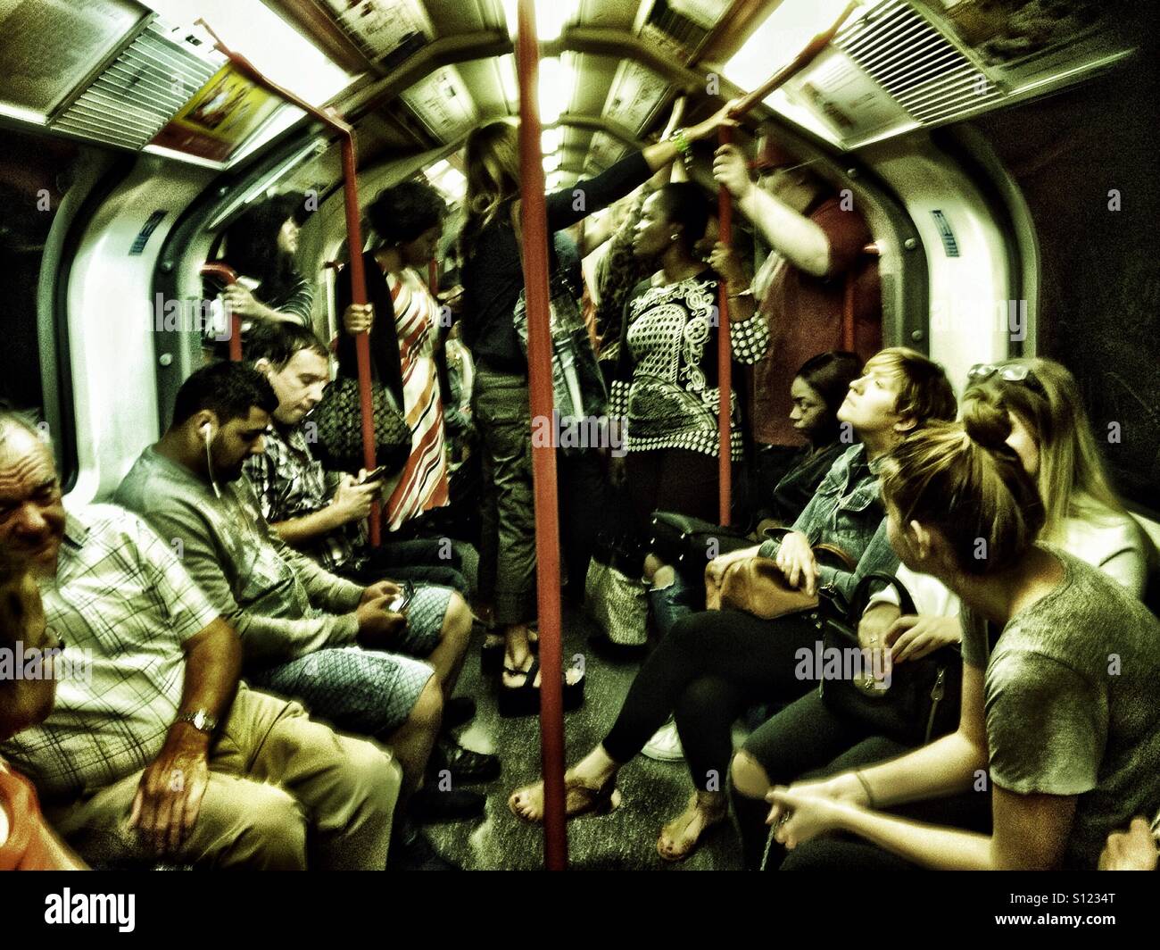Passengers onboard a London Underground train. - Smartphone Captured Stock Image