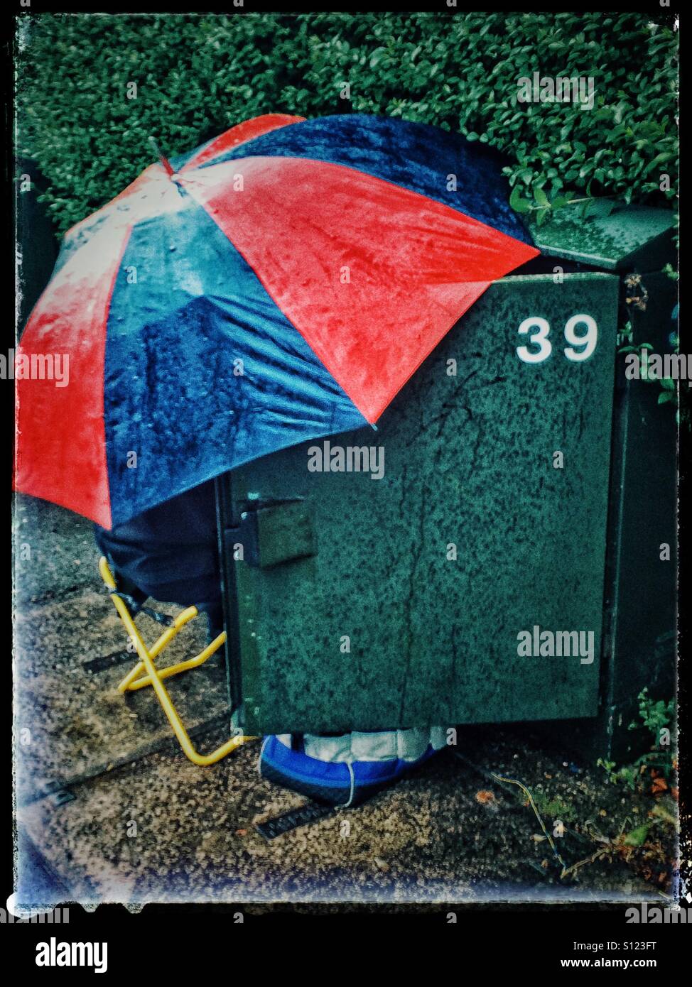 Fixing the phone lines in the rain - Smartphone Captured Stock Image