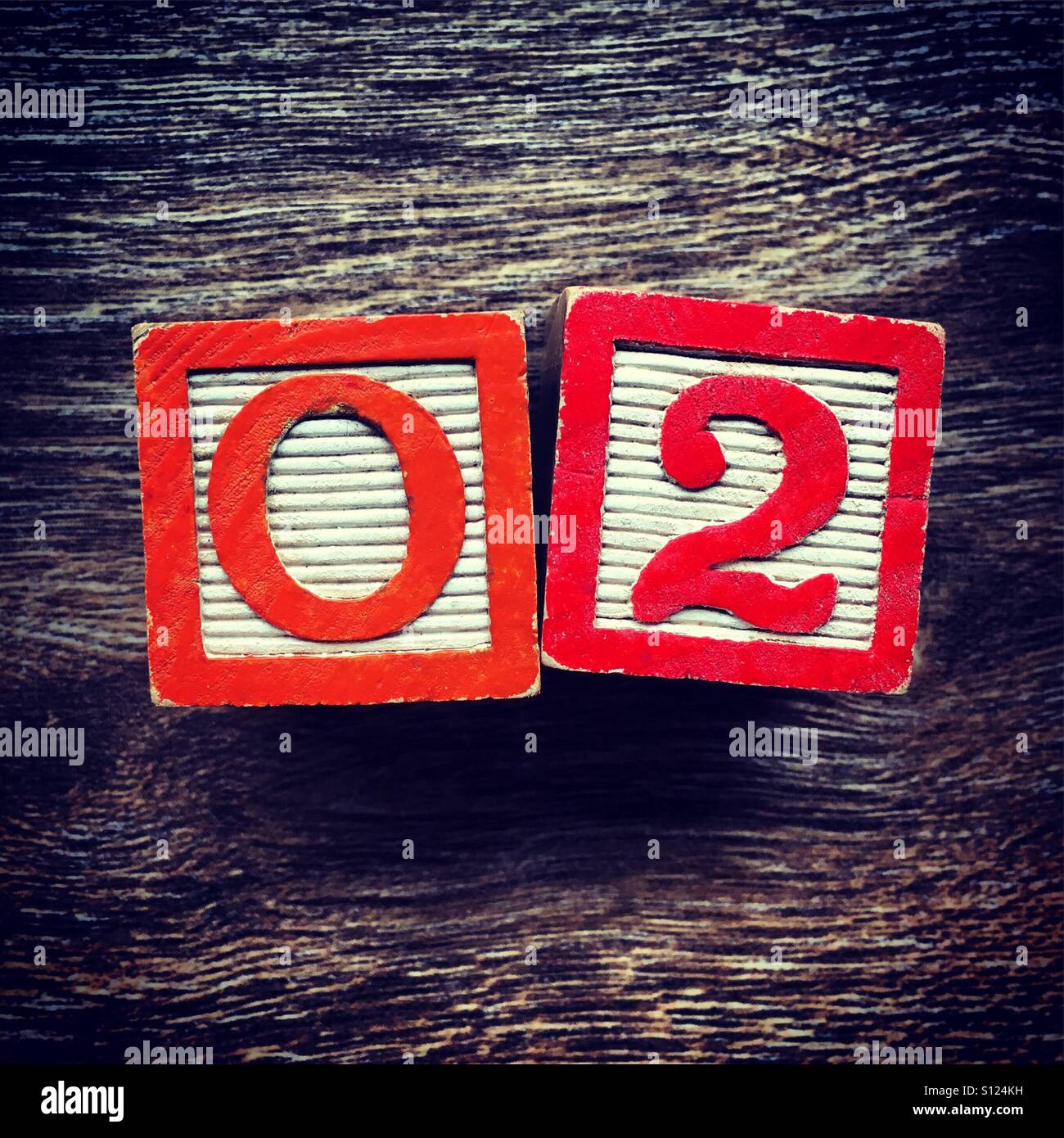 O2 abbreviation written with wood block letter toys - Smartphone Captured Stock Image