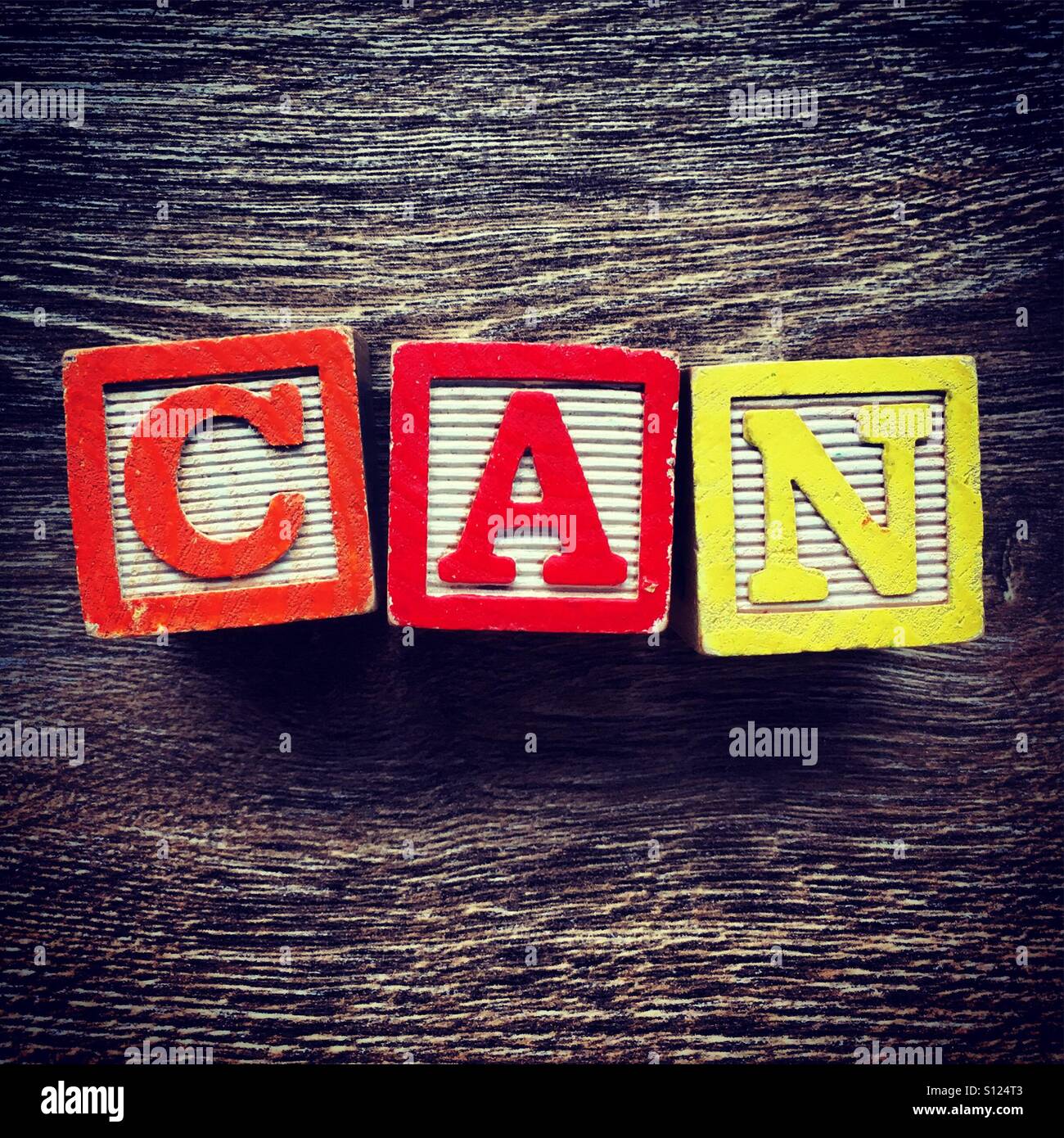 CAN word written with wood block letter toys - Smartphone Captured Stock Image