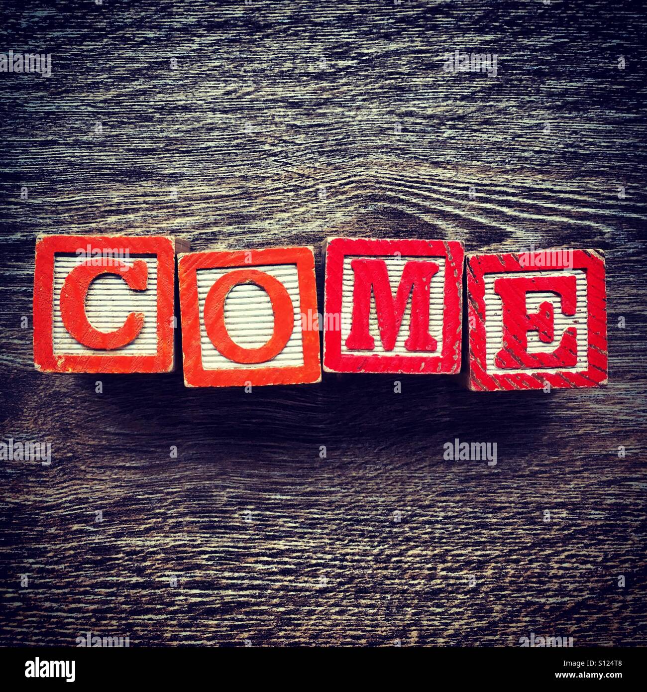 COME word written with wood block letter toys Stock Photo Alamy