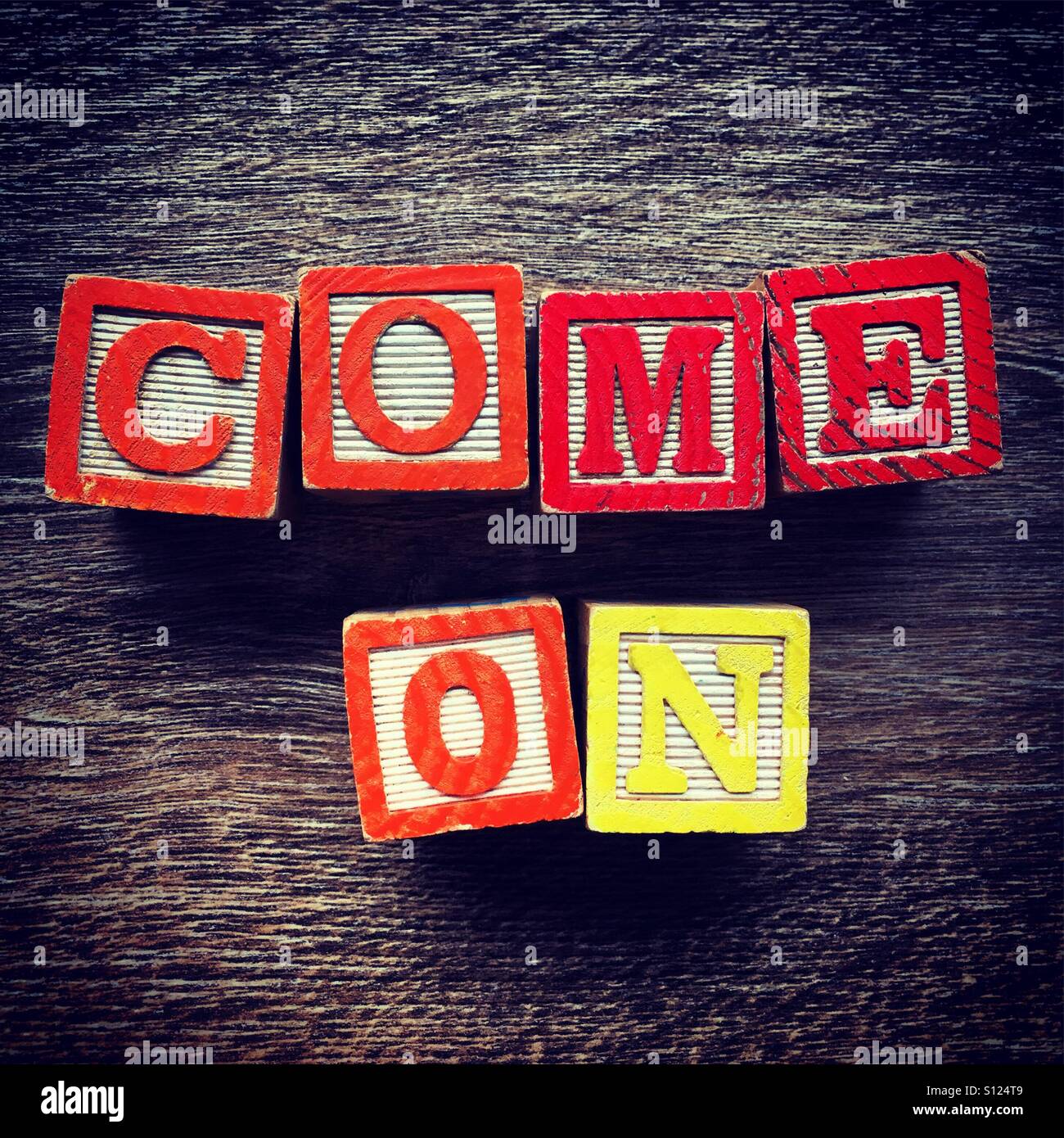 COME ON word written with wood block letter toys - Smartphone Captured Stock Image
