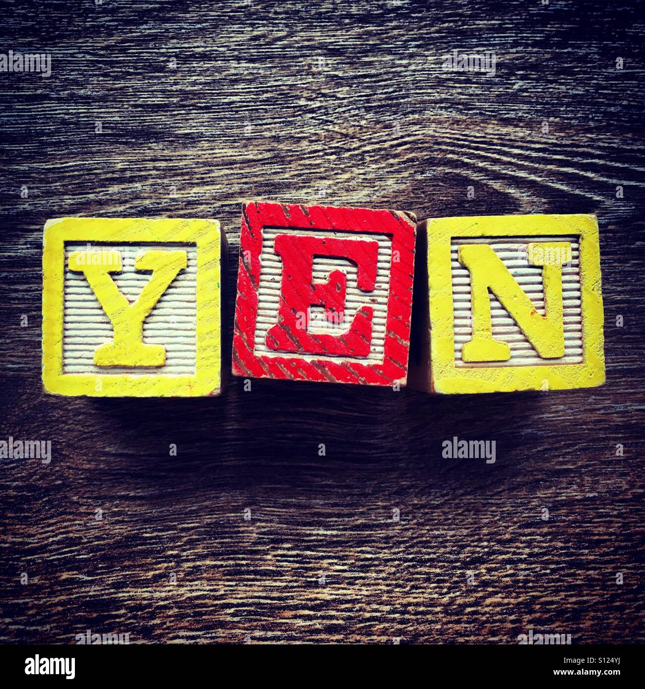 YEN word written with wood block letter toys Stock Photo