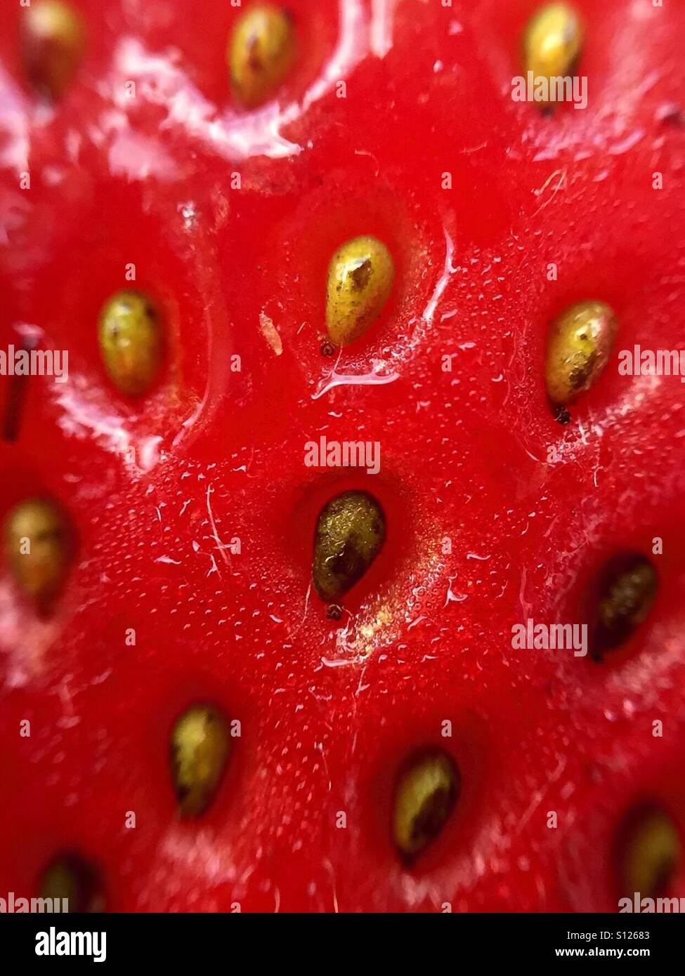 Extreme close up of a strawberry filling the frame - Smartphone Captured Stock Image