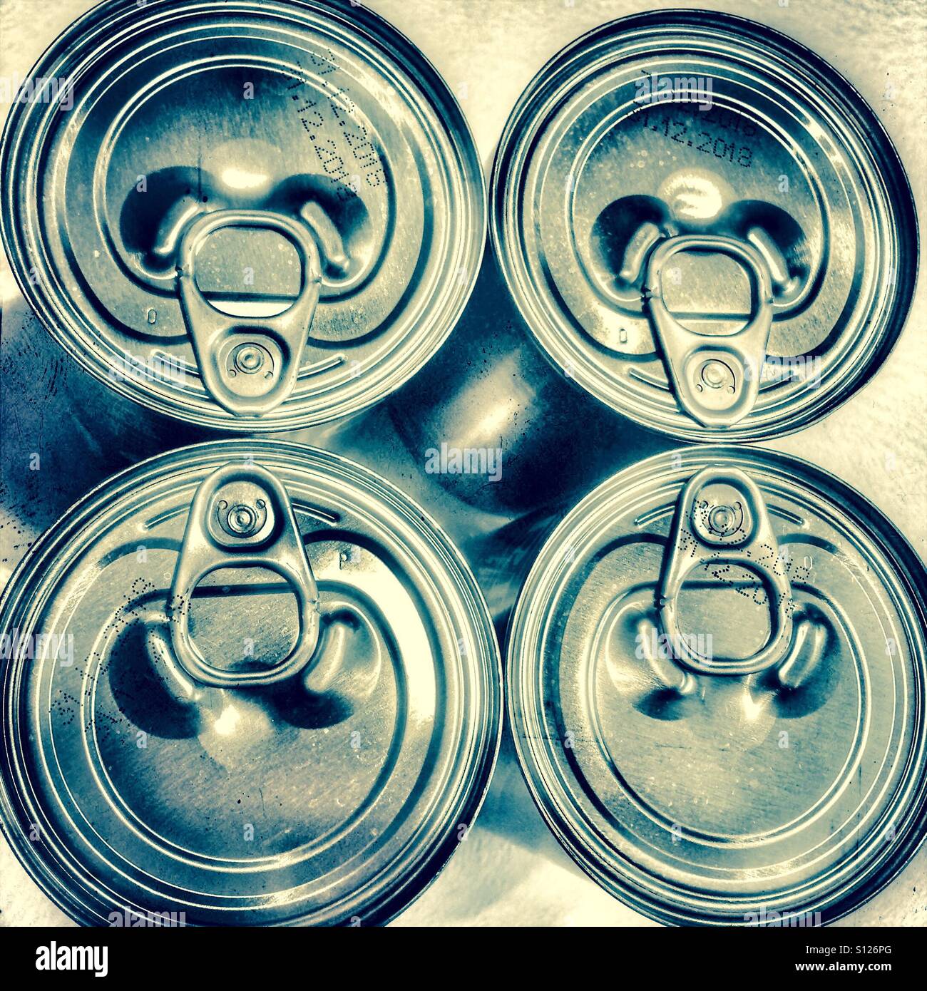 Four ring pull cans from above Stock Photo Alamy