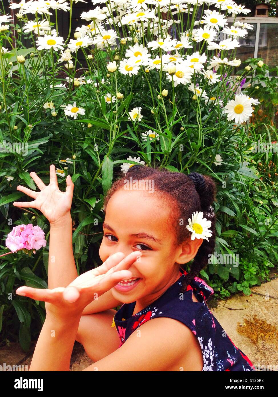 A flower in her hair Stock Photo - Alamy
