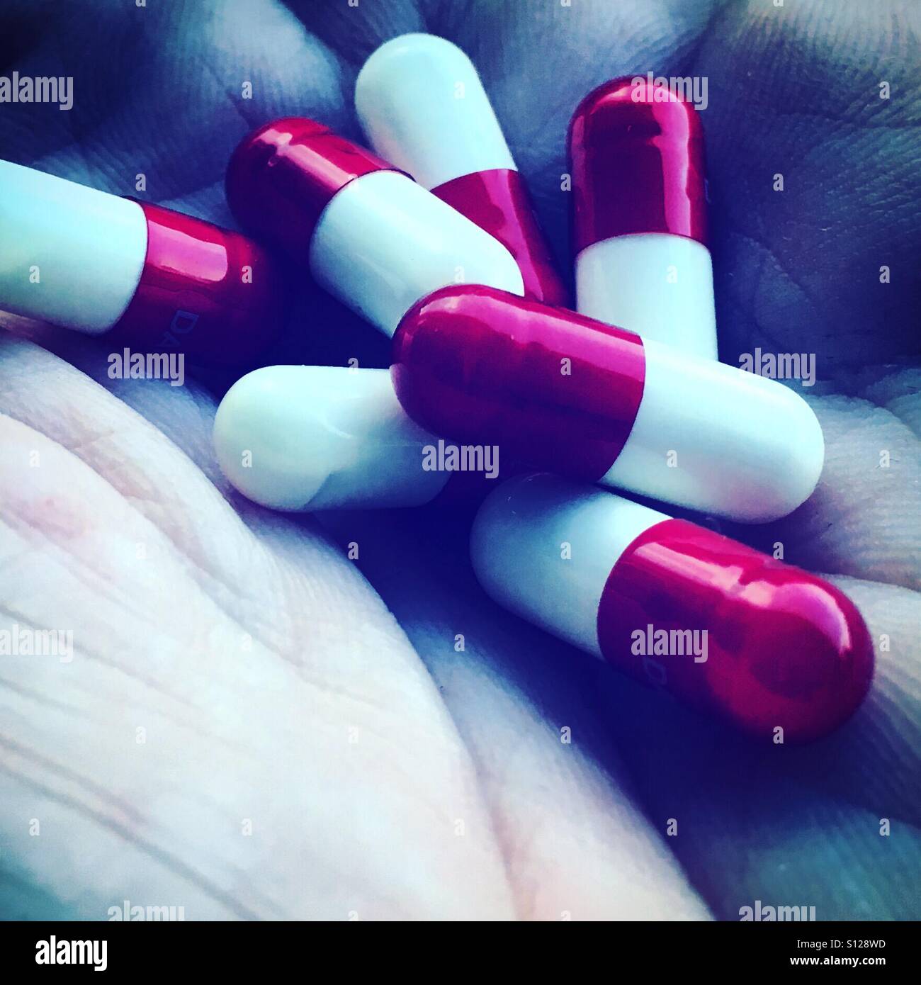 Drugs in hand - Smartphone Captured Stock Image