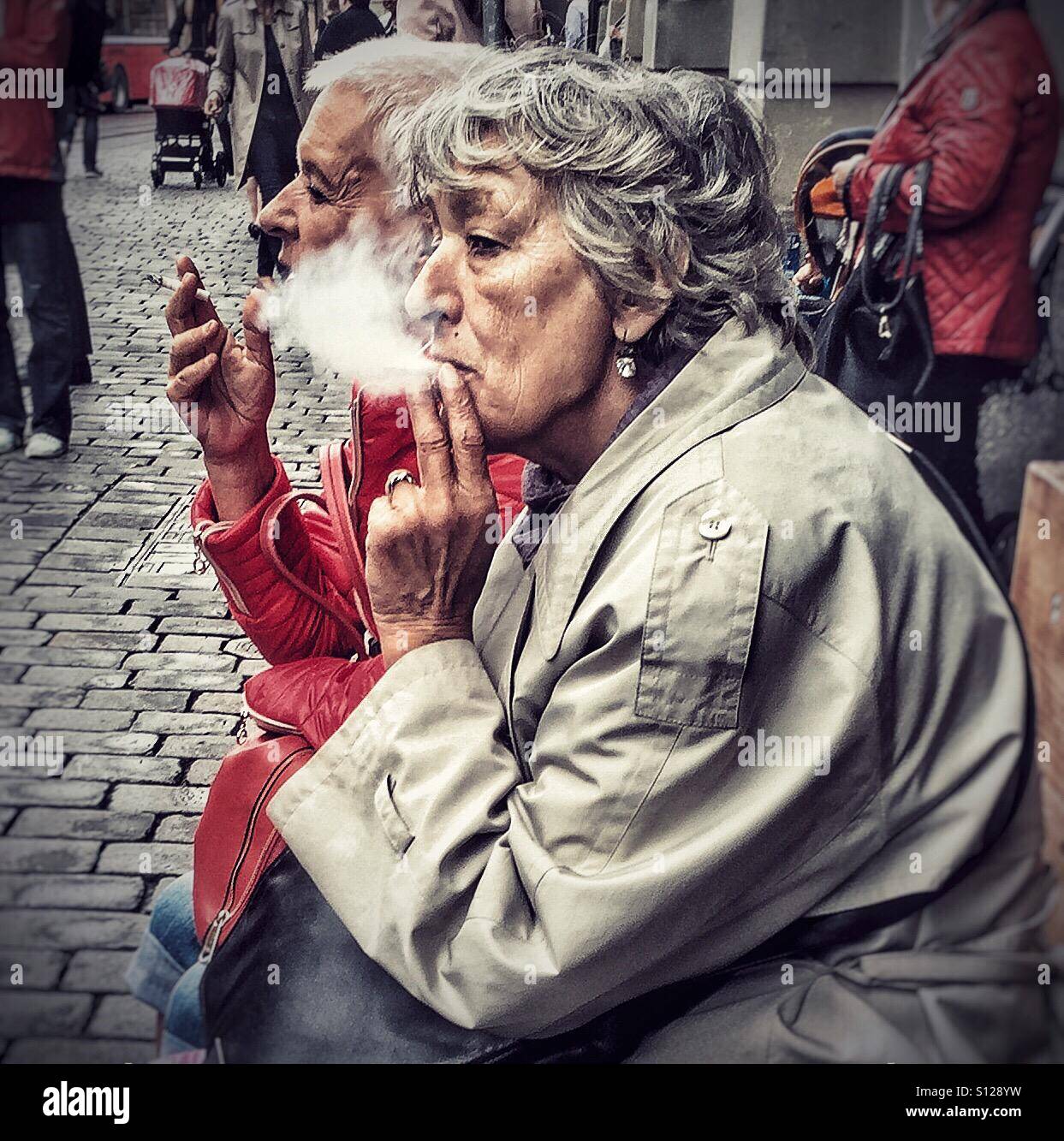 Two elderly ladies enjoying a smoke Stock Photo