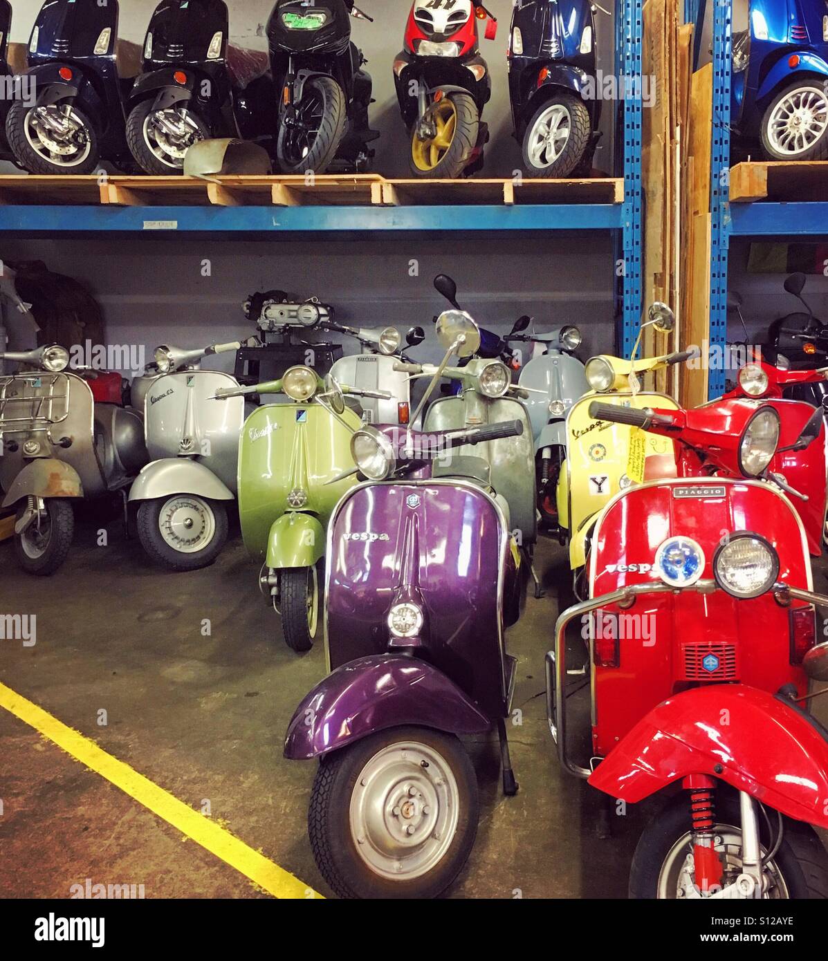 Vintage scooters in a garage Stock Photo