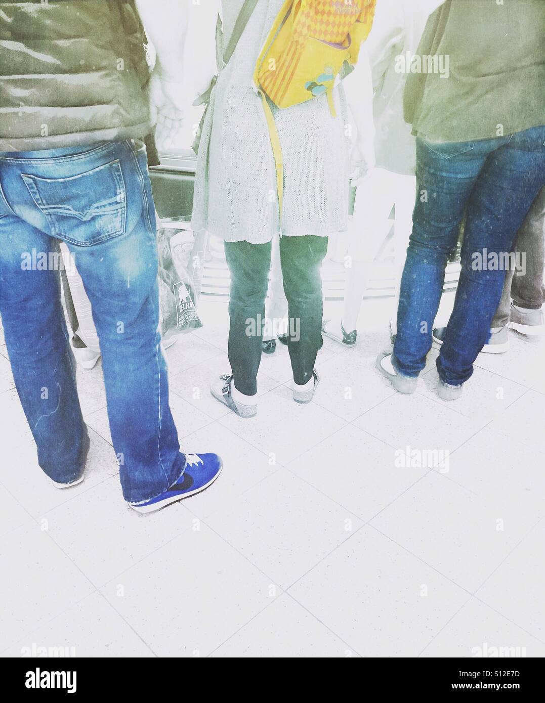 People waiting in front of a shop counter. - Smartphone Captured Stock Image