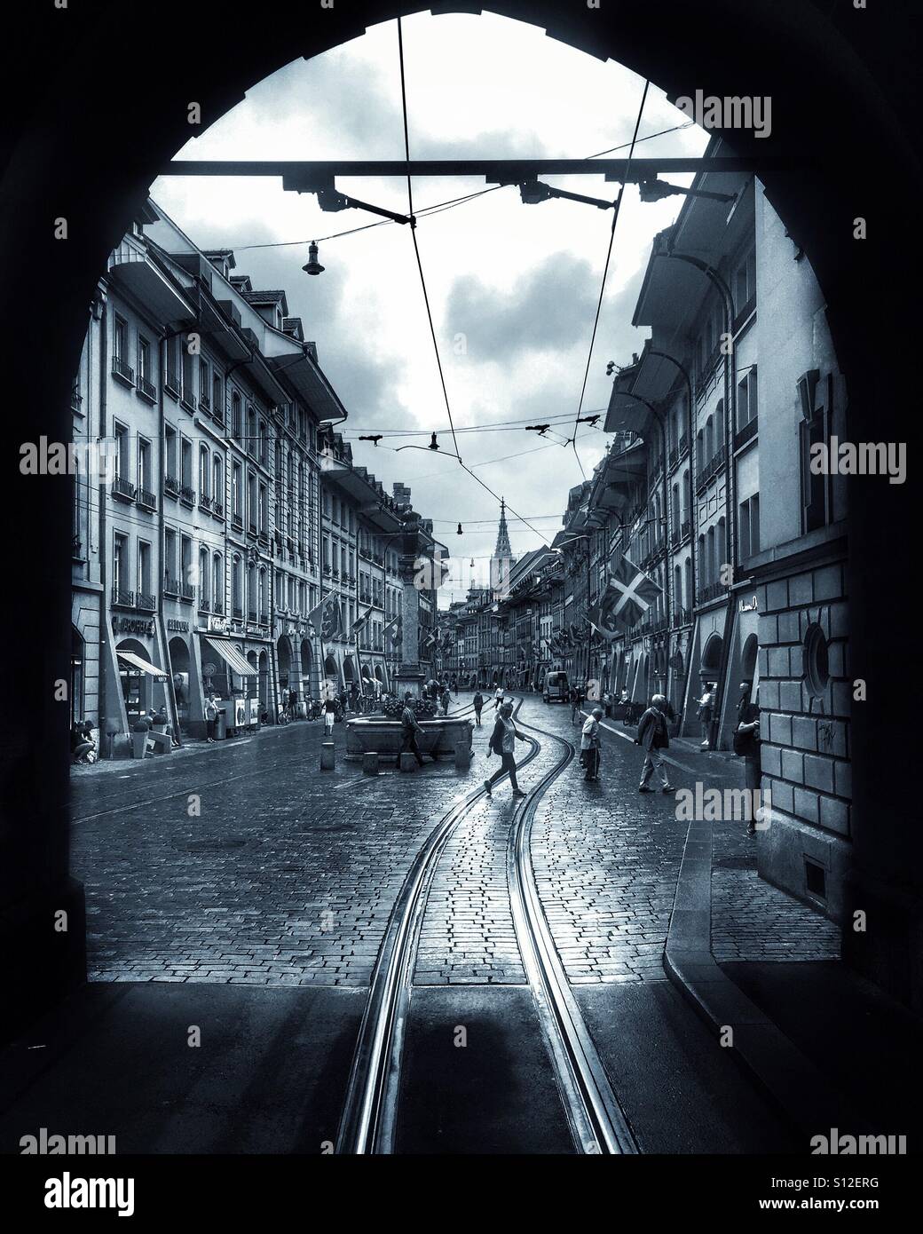 Marktgasse, the main shopping street of Bern, Switzerland, through the arch of the old prison tower - Smartphone Captured Stock Image
