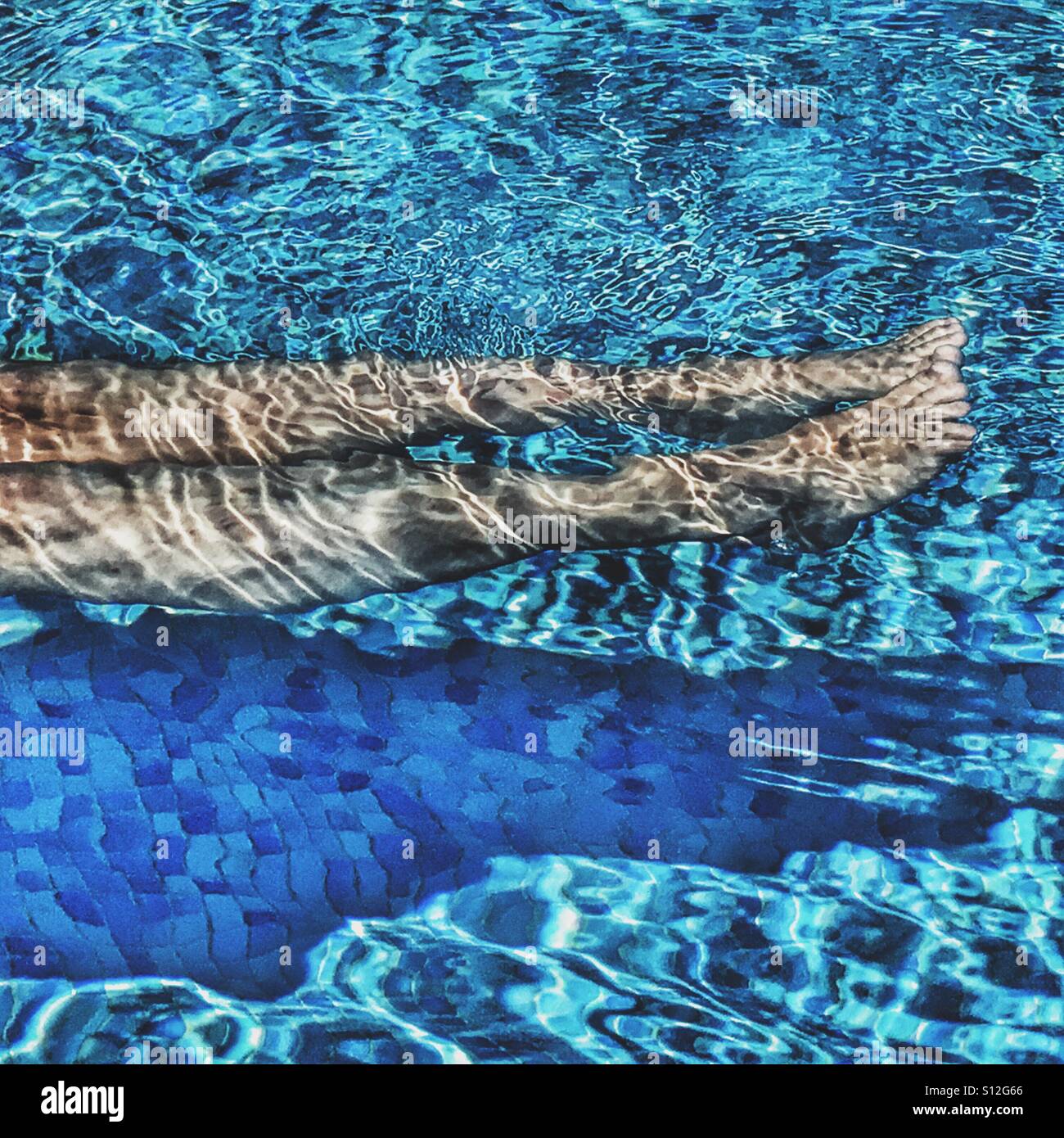 Summer fun. Relaxing in swimming pool. - Smartphone Captured Stock Image