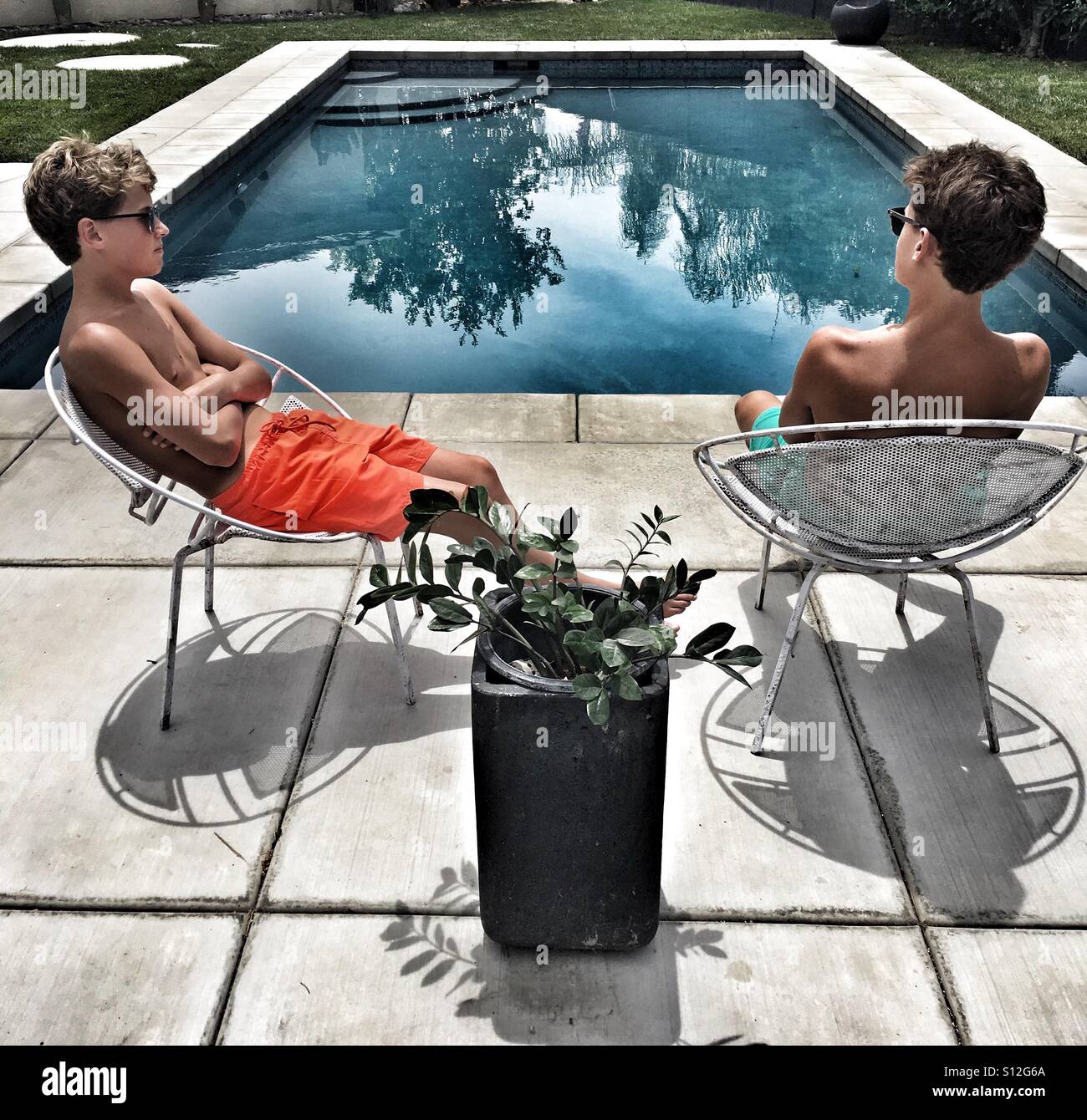 Brothers...poolside. Summer... Stock Photo