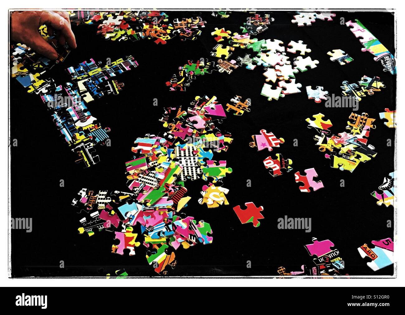 Jigsaw puzzle on black background Stock Photo - Alamy
