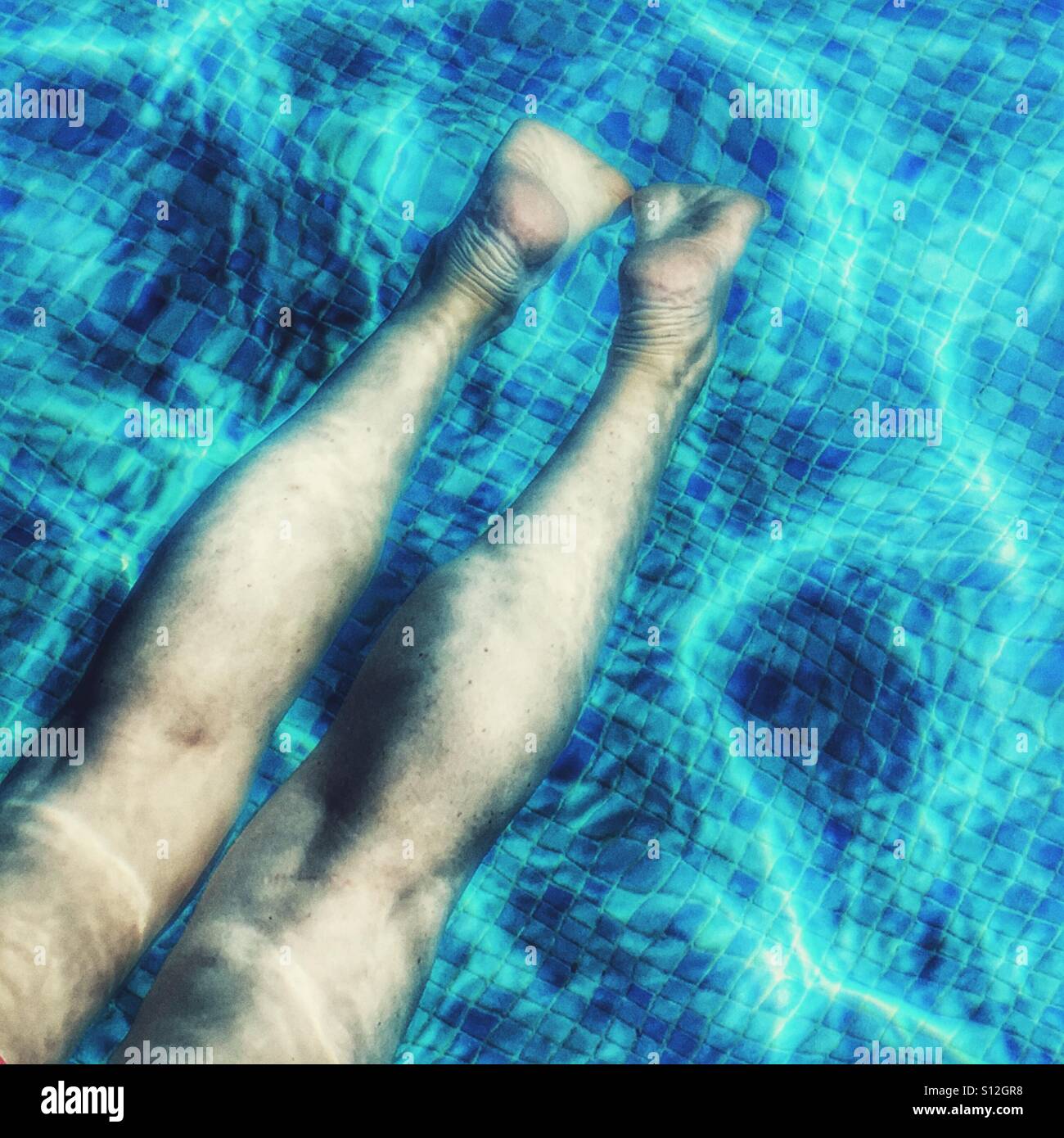 Summer fun. Relaxing in swimming pool - Smartphone Captured Stock Image