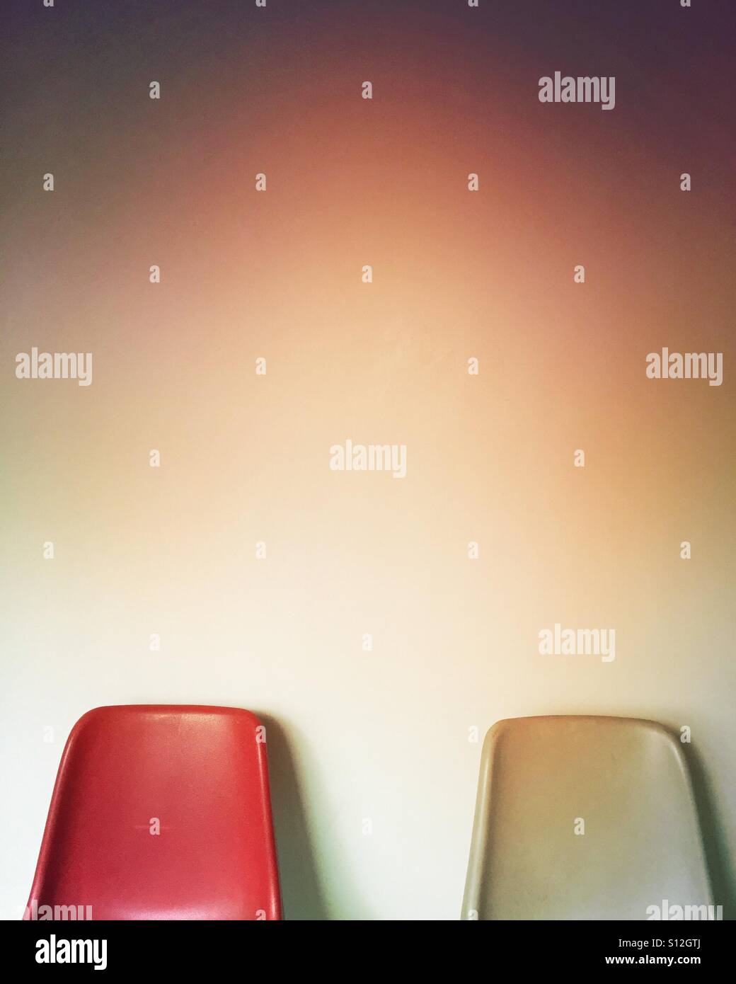 Single red chair in waiting room - Smartphone Captured Stock Image