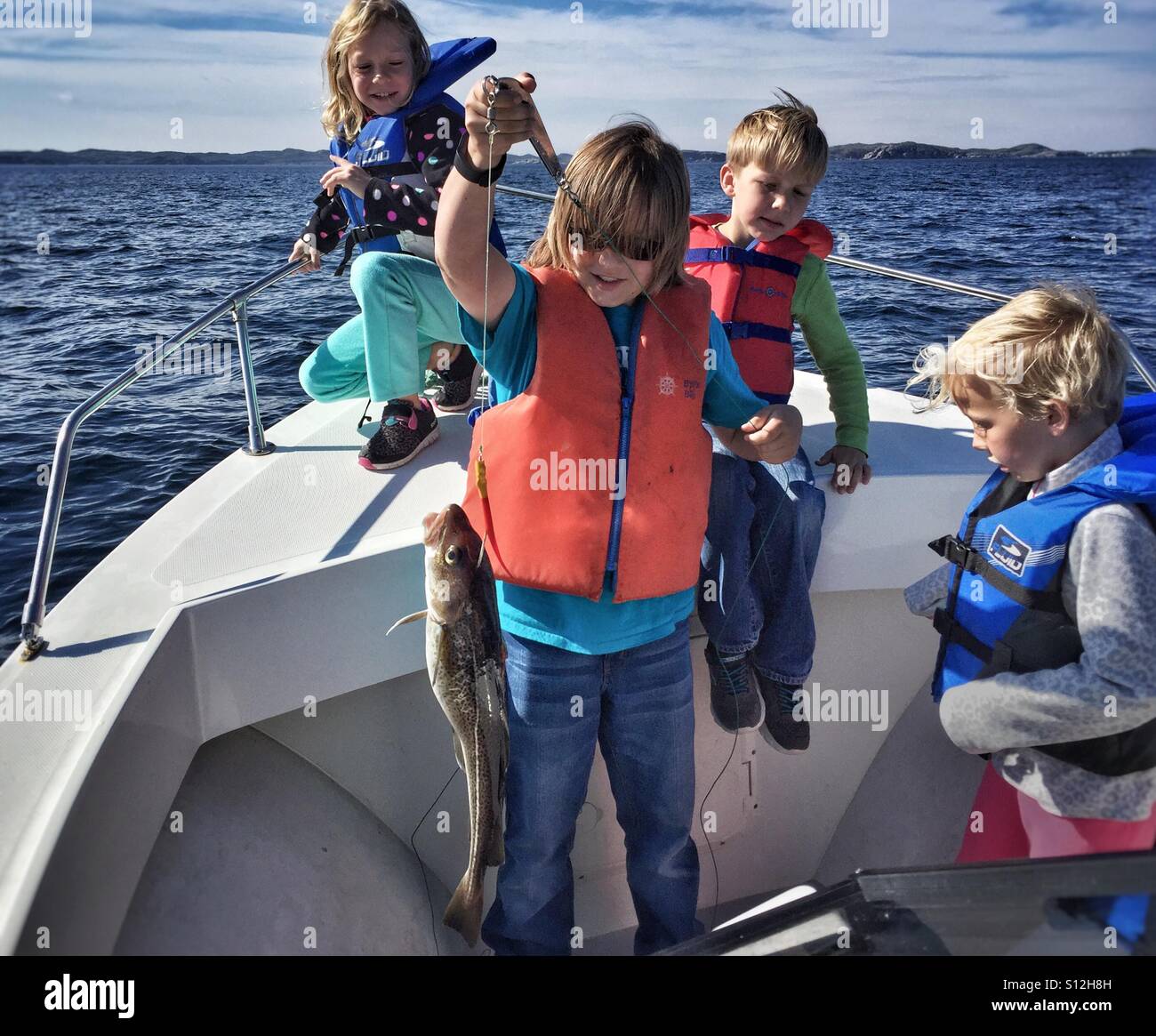 Kids Fishing Boat Photos, Images and Pictures