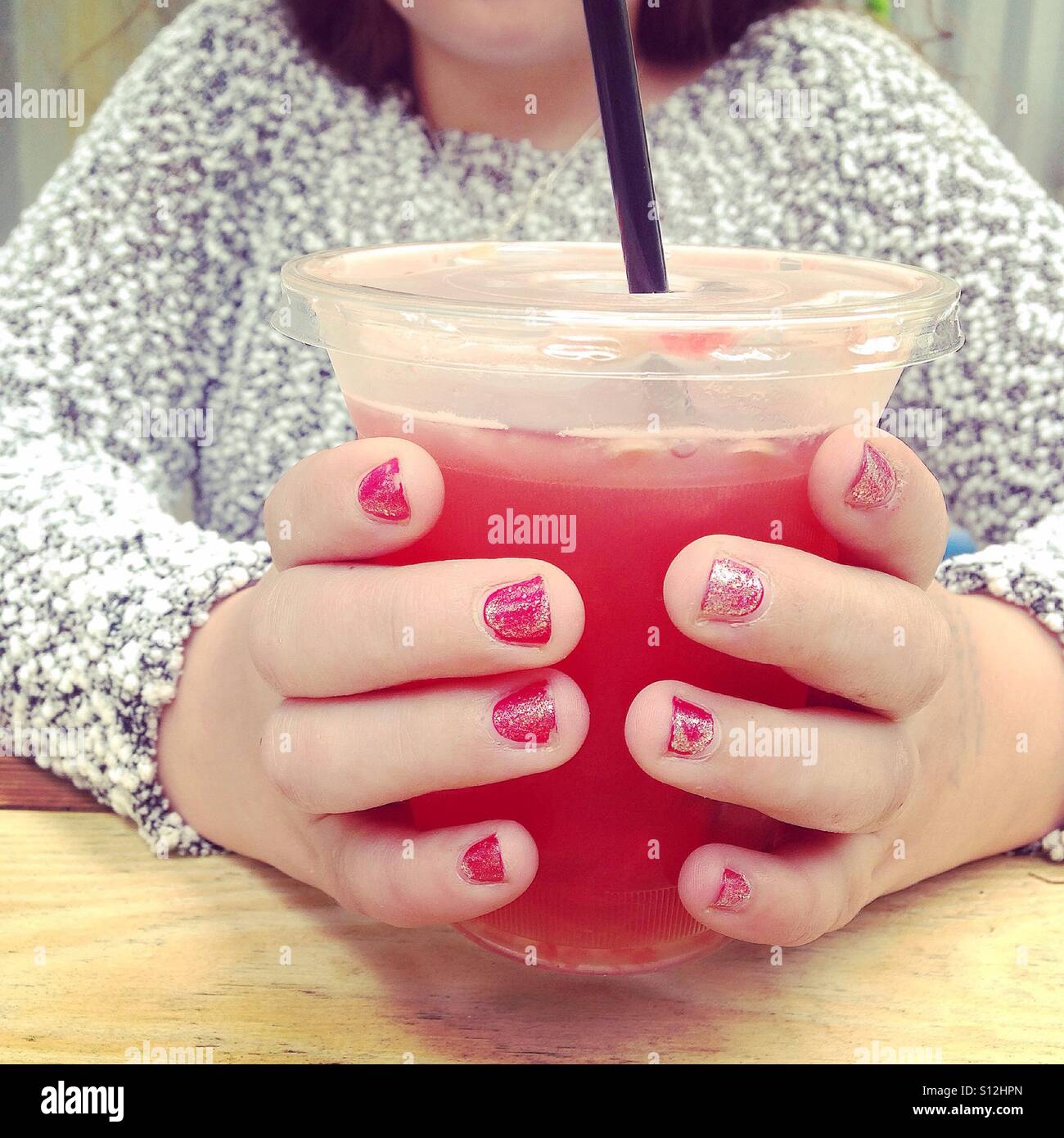 Girl drinking watermelon juice - Smartphone Captured Stock Image