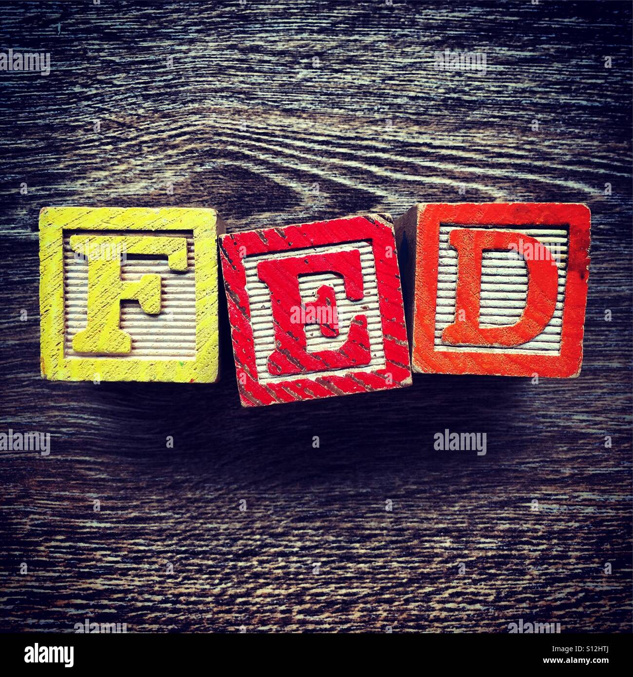 FED word written with wood block letter toys - Smartphone Captured Stock Image