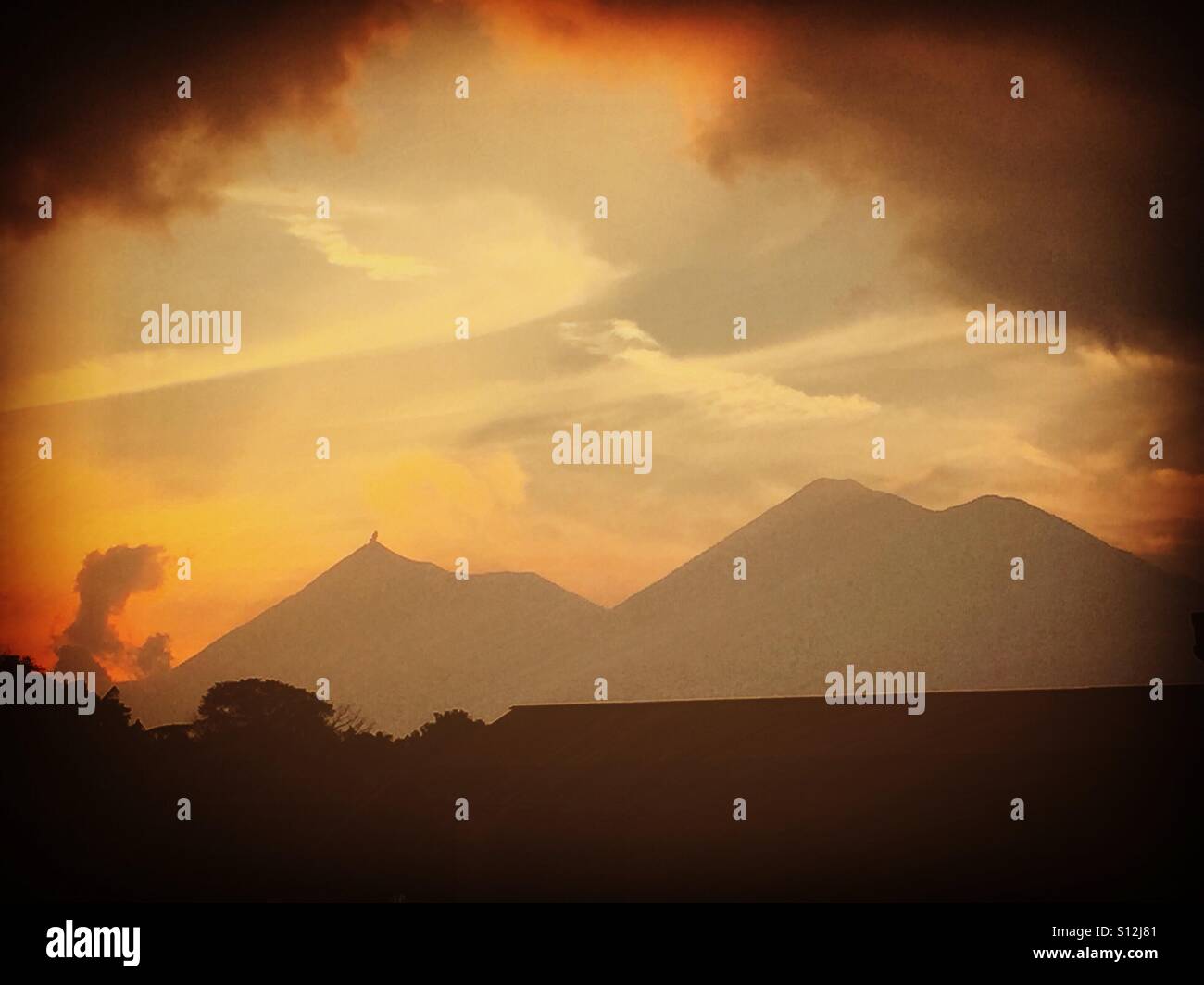 Fuego Volcano & Acatenango Volcano at sunset, Antigua, Guatemala - Smartphone Captured Stock Image