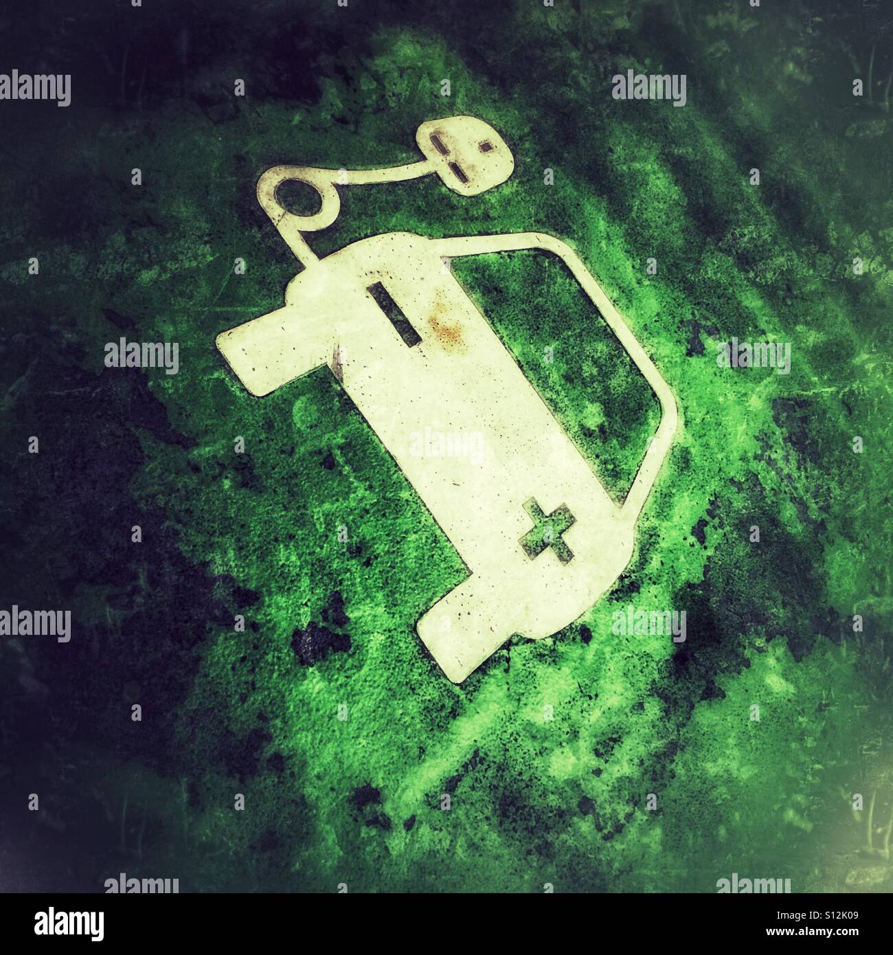 Electric car charging point symbol marked on parking bay of car park - Smartphone Captured Stock Image