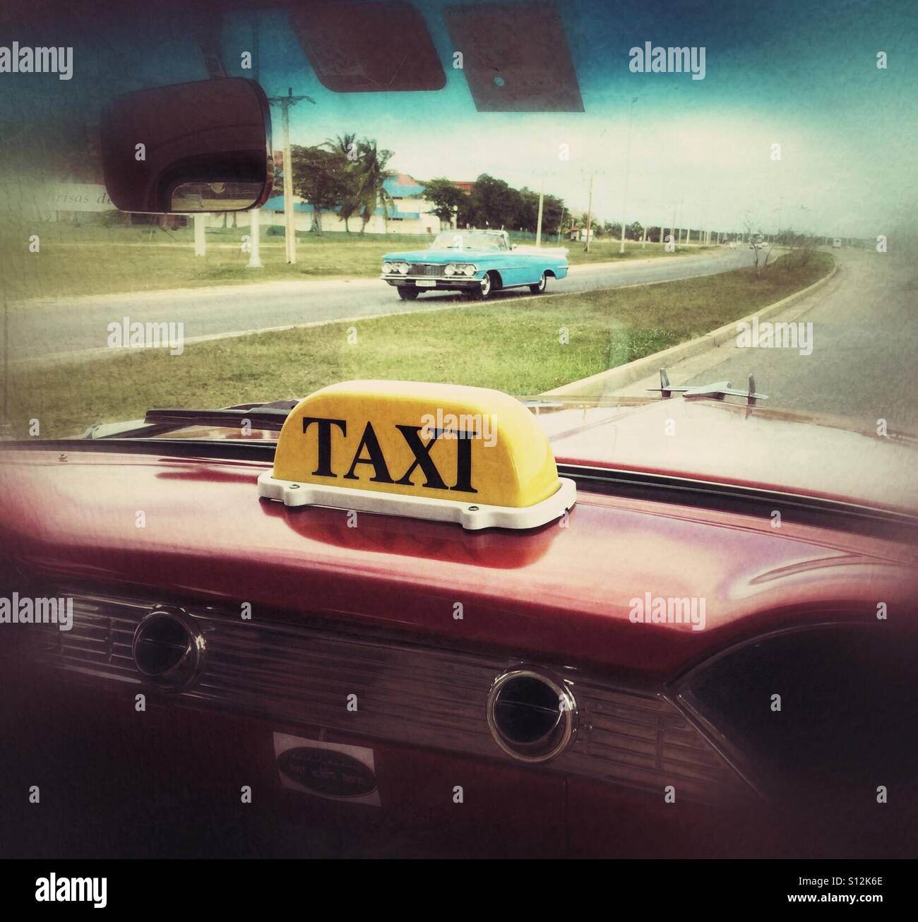 A classic taxi ride in Cuba, on the road with vintage cars. - Smartphone Captured Stock Image