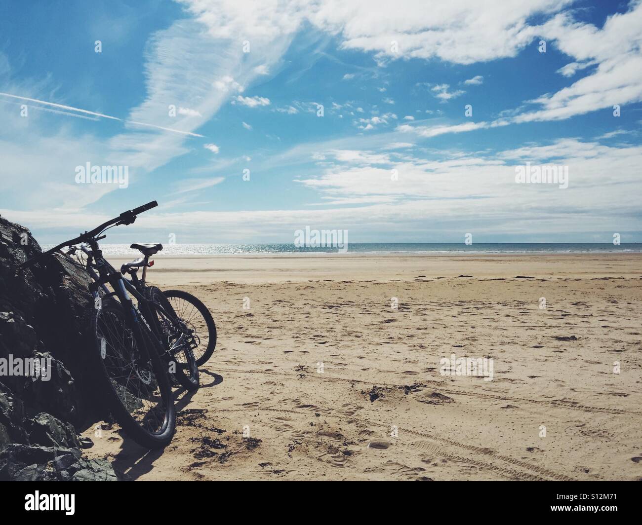 Cycling around Anglesey, Newborough Beach, Newborough forest, Anglesey, North Wales on a hot sunny day in July 2016 - Smartphone Captured Stock Image