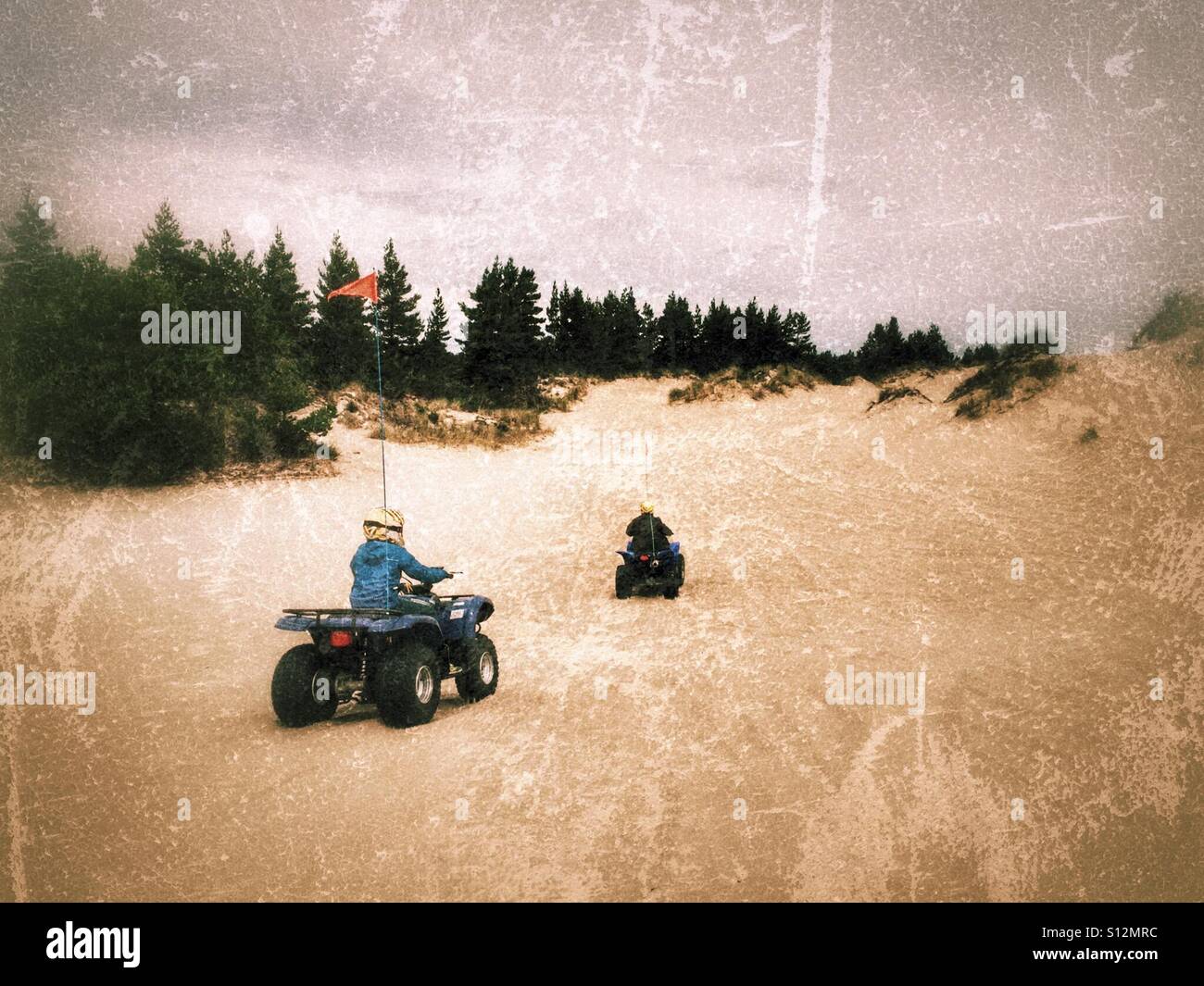 Two quad riders in the sand dunes of Oregon, USA. - Smartphone Captured Stock Image