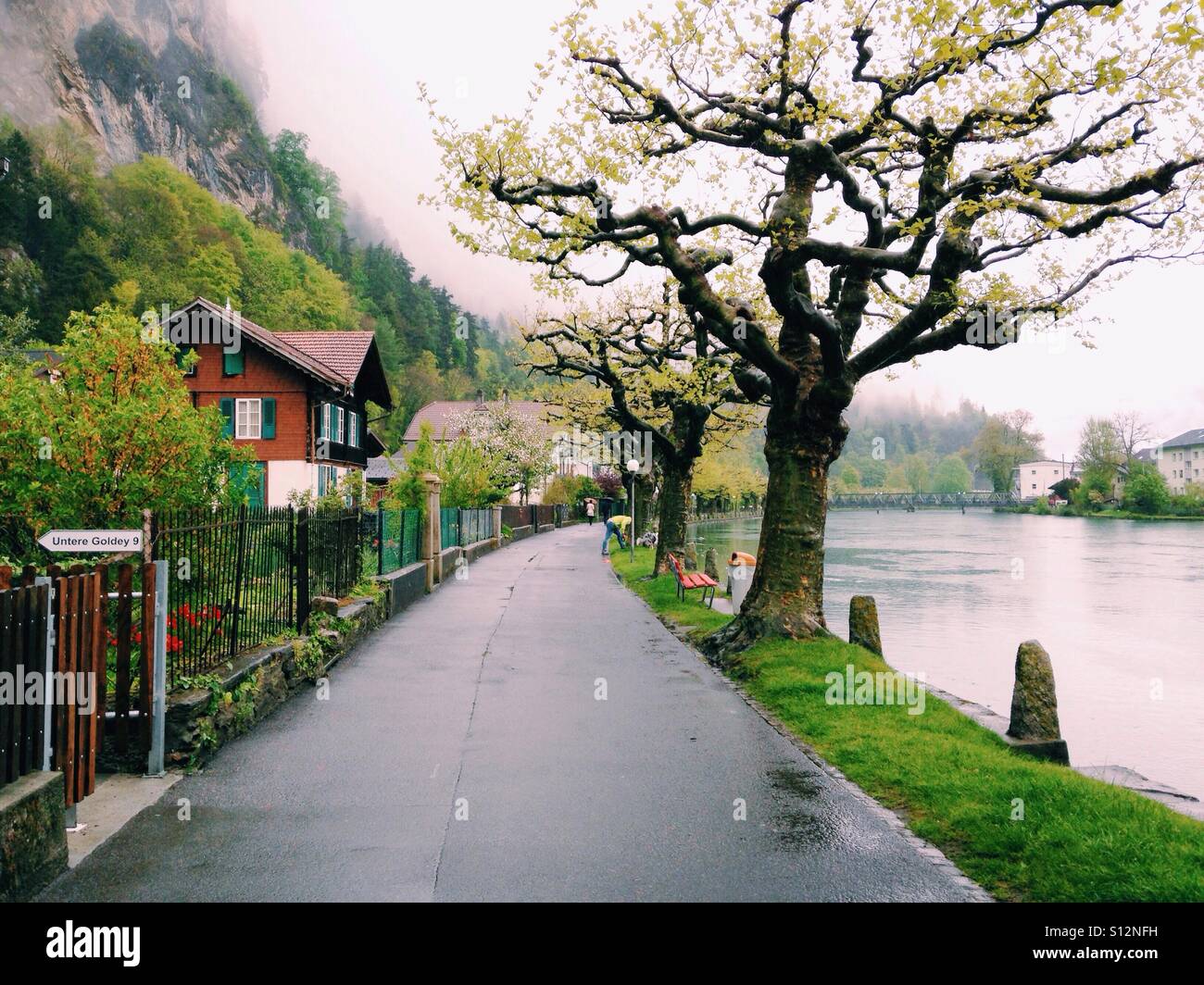 A road along the lake in Interlaken, Switzerland Stock Photo Alamy